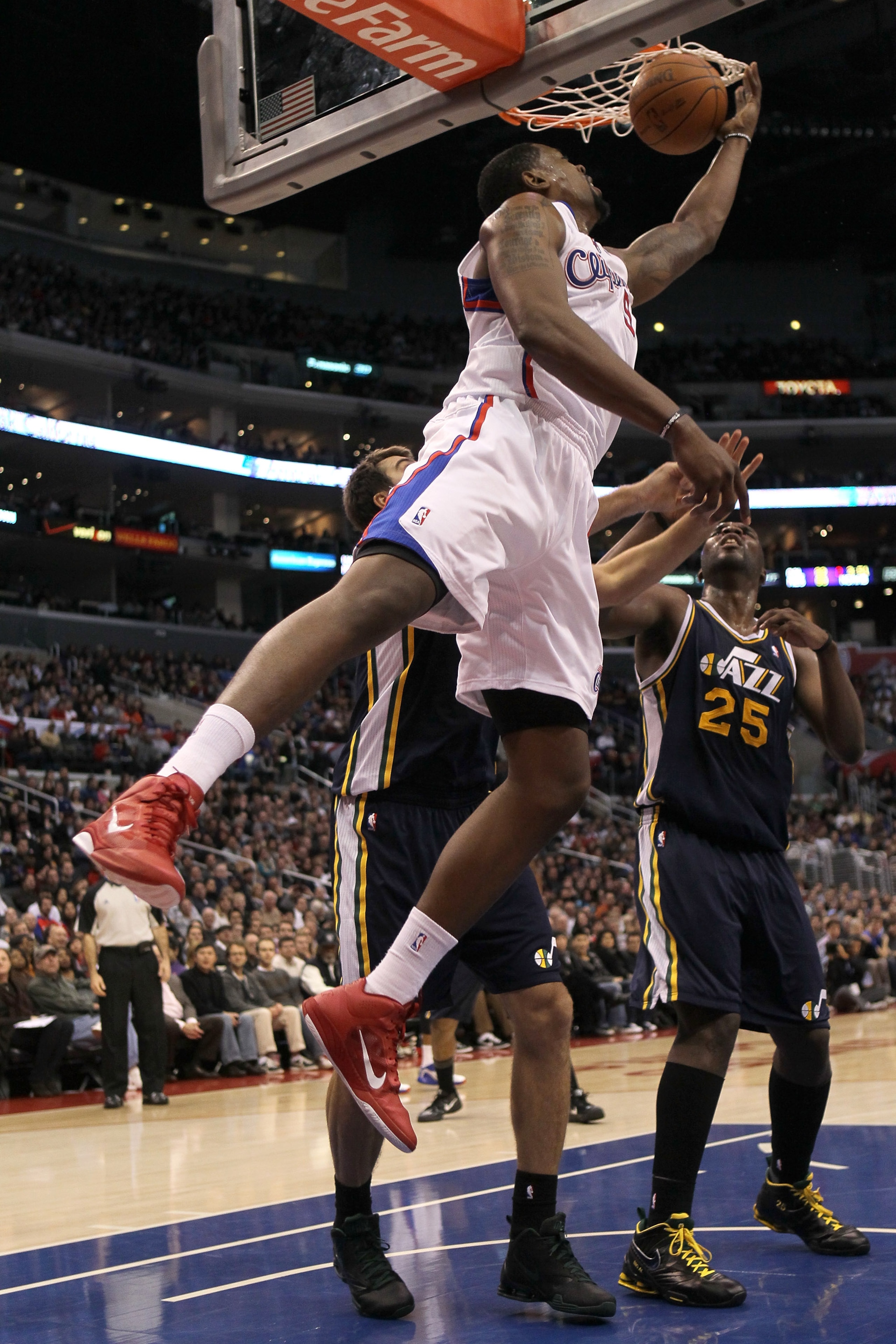 LOS ANGELES, CA - DECEMBER 29:  DeAndre Jordan #9 of the Los Angeles Clippers tries to get off a shot against the Utah Jazz at Staples Center on December 29, 2010 in Los Angeles, California.       The Jazz won 103-85.  NOTE TO USER: User expressly acknowl