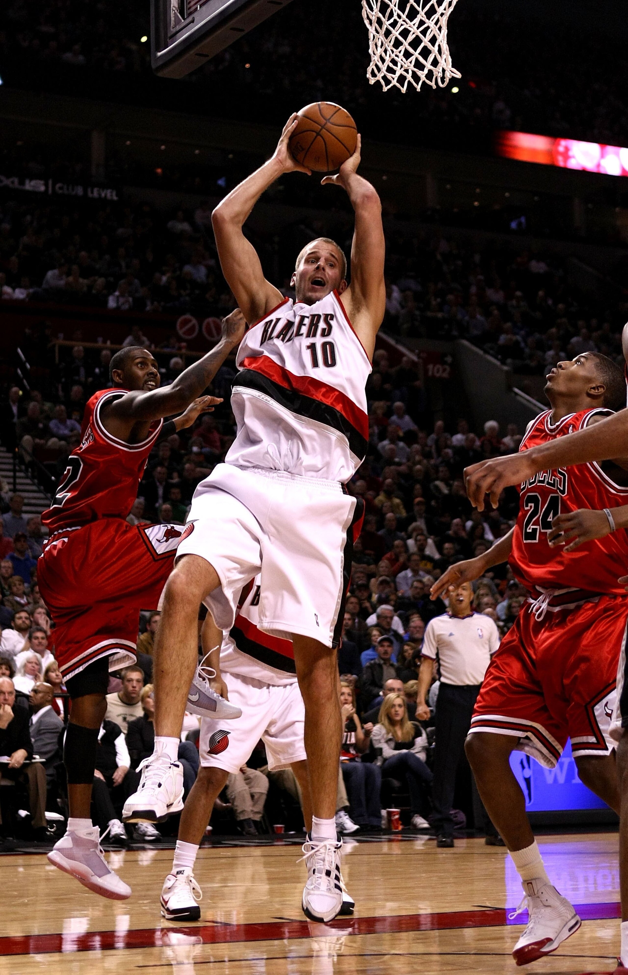 PORTLAND, OR - NOVEMBER 19:  Joel Przybilla #10 of the Portland Trail Blazers grabs a rebound over Larry Hughes #32 and Tyrus Thomas #24 of the Chicago Bulls at the Rose Garden on November 6, 2008 in Portland, Oregon.  NOTE TO USER: User expressly acknowl