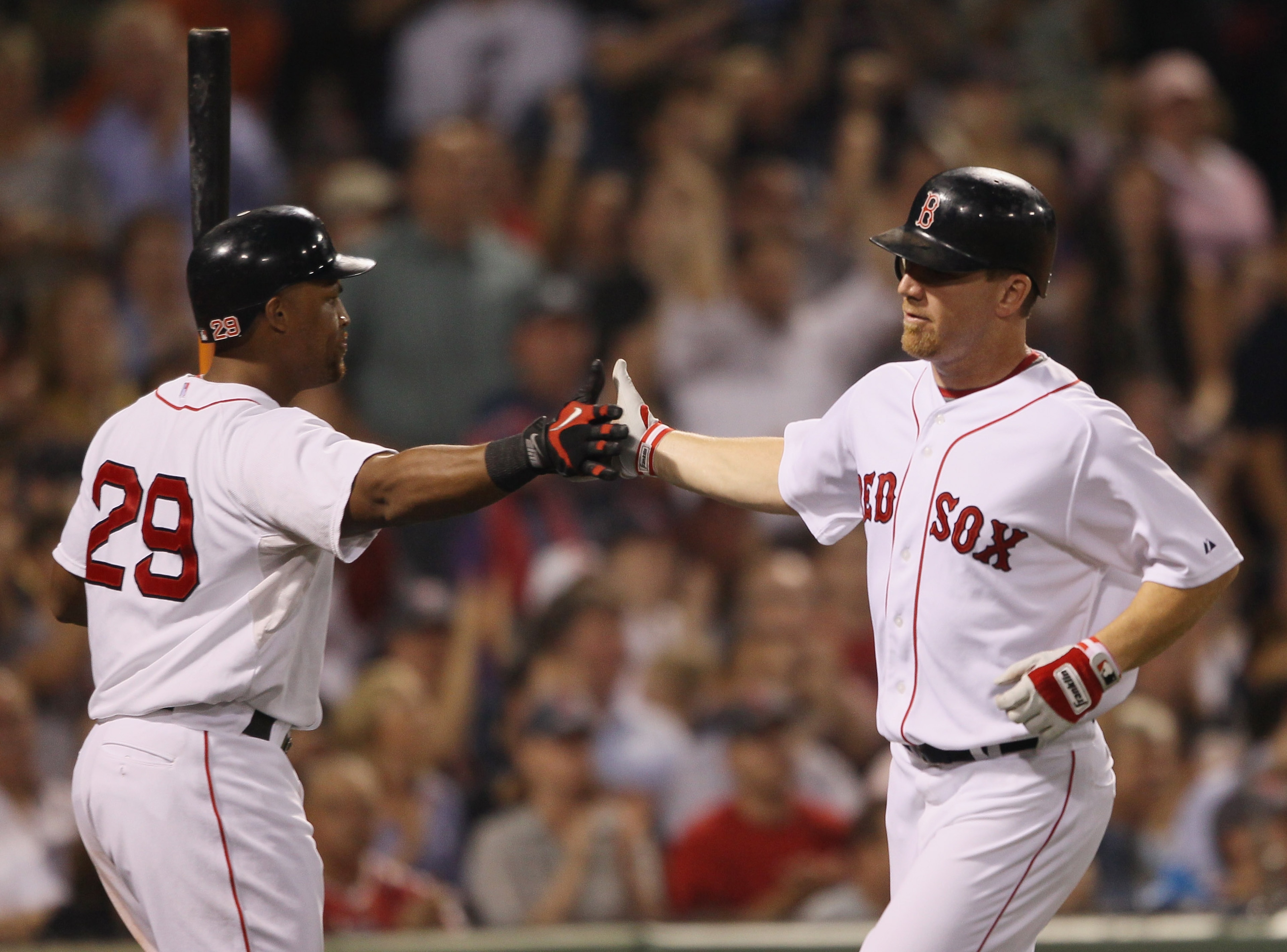 BOSTON - SEPTEMBER 22:  J.D. Drew #7 of the Boston Red Sox is congratulated by teammate Adrian Beltre #29 after Drew scored on a single from David Oritz in the sixth inning against the Baltimore Orioles on September 22, 2010 at Fenway Park in Boston, Mass