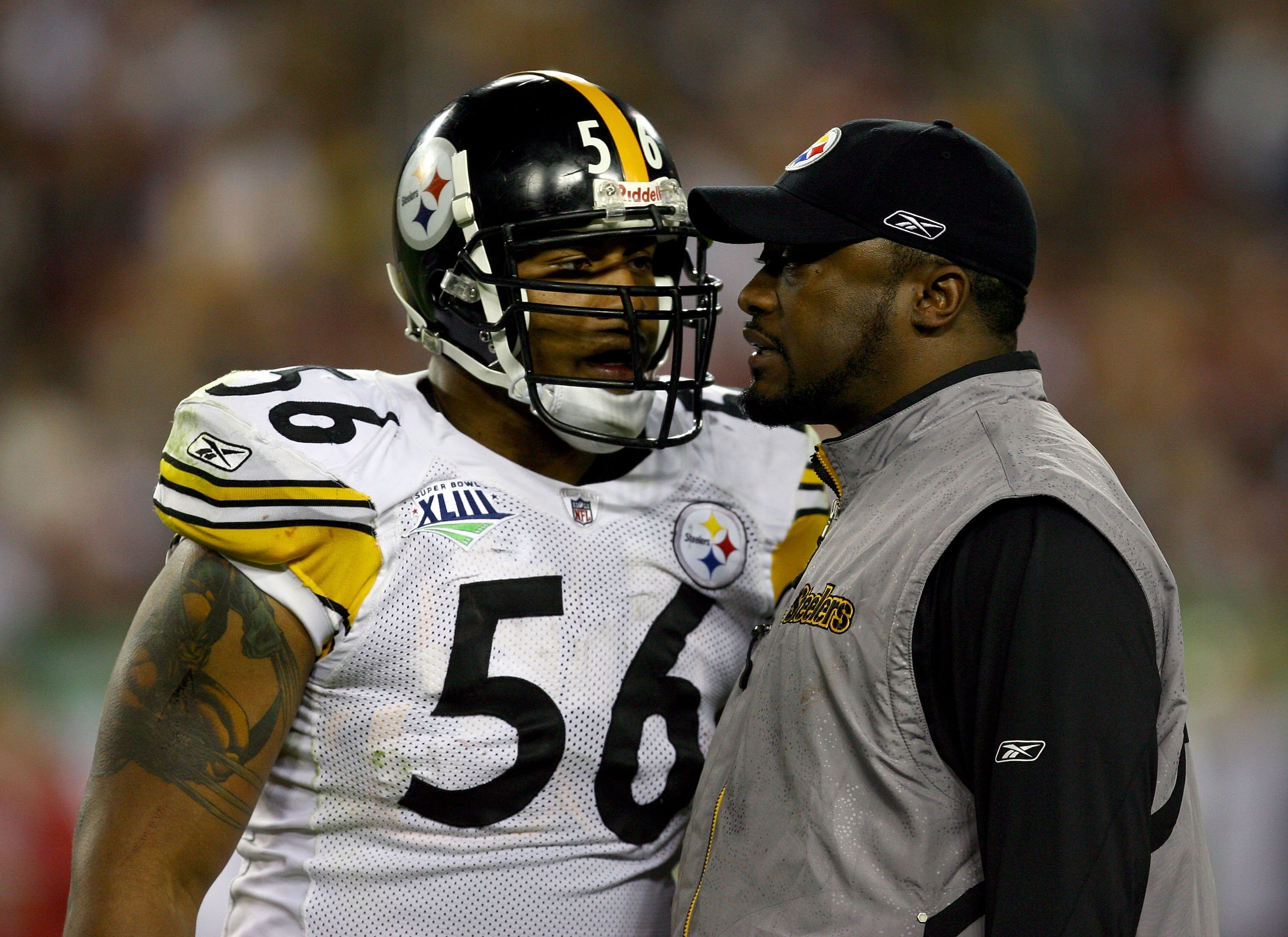TAMPA, FL - FEBRUARY 01:  (L-R) LaMarr Woodley and head coach Mike Tomlin of the Pittsburgh Steelers talk against the Arizona Cardinals during Super Bowl XLIII on February 1, 2009 at Raymond James Stadium in Tampa, Florida.  (Photo by Jamie Squire/Getty I