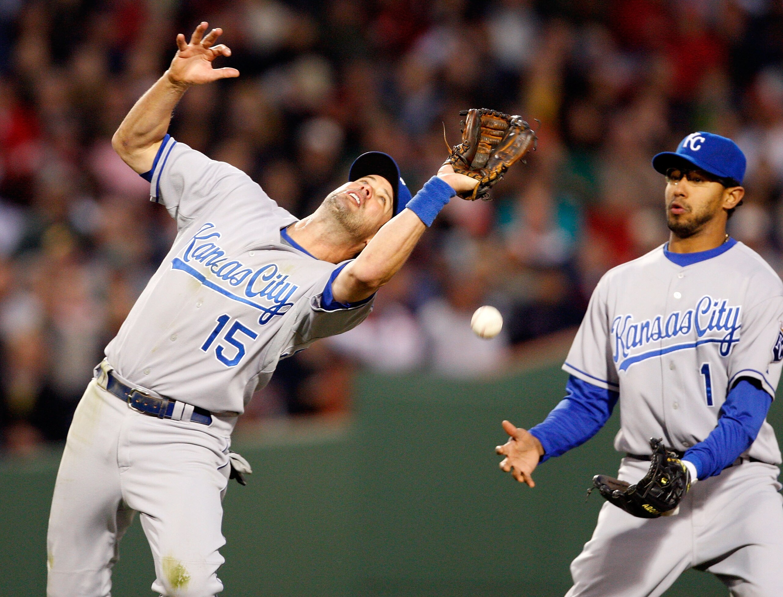 BOSTON - MAY 19:   Tony Pena Jr. #1 watches as teammate Mark Grudzielanek #15, both of the Kansas City Royals, drops a pop fly off of the bat of Mike Lowell #25 of the Boston Red Sox at Fenway Park on May 19, 2008 in Boston, Massachusetts.  The error allo