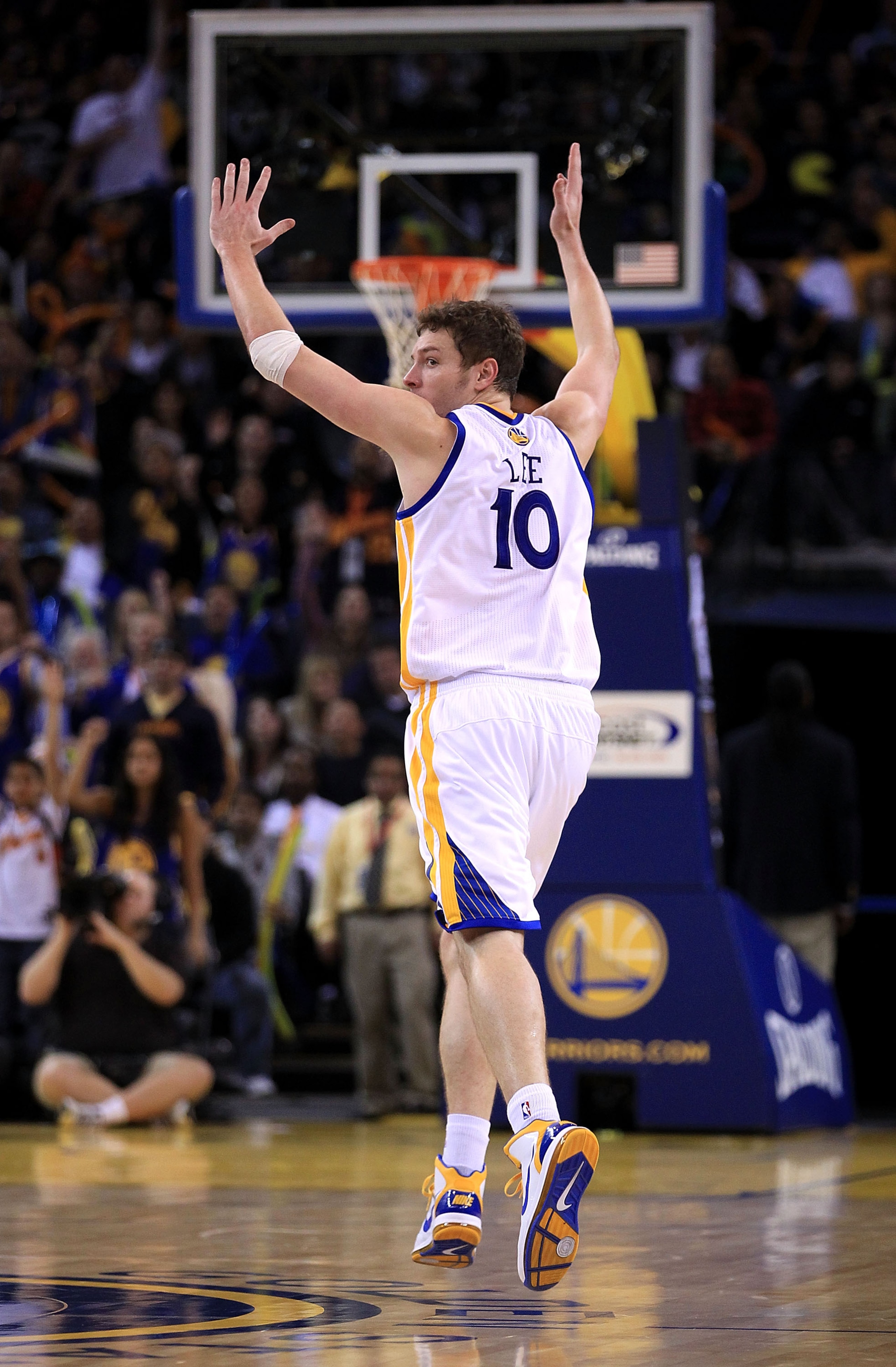 OAKLAND, CA - JANUARY 21:  David Lee #10 of the Golden State Warriors celebrates after the Warriors made a basket during their game against the Sacramento Kings at Oracle Arena on January 21, 2011 in Oakland, California. NOTE TO USER: User expressly ackno