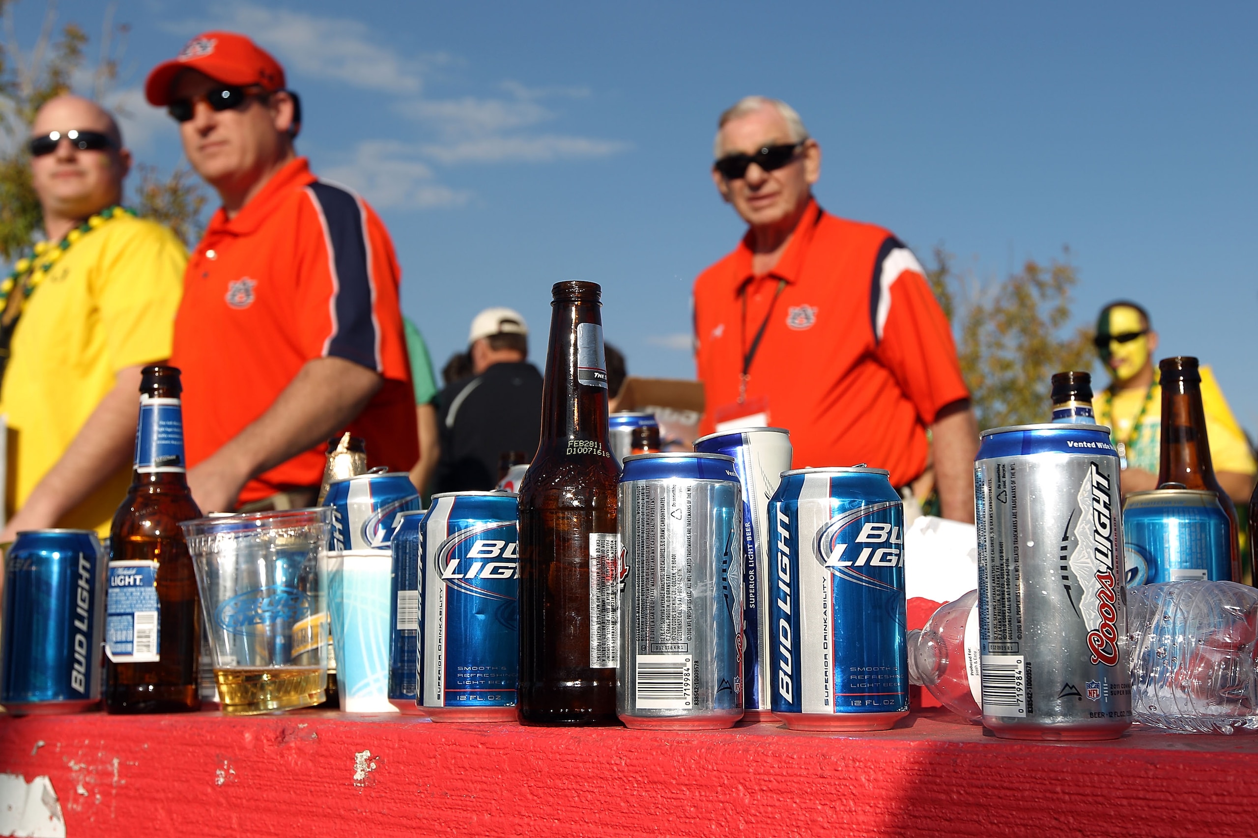 GLENDALE, AZ - JANUARY 10:  Fans walk by the alcohol collection table before the Tostitos BCS National Championship Game between the Oregon Ducks and the Auburn Tigers at University of Phoenix Stadium on January 10, 2011 in Glendale, Arizona.  (Photo by C