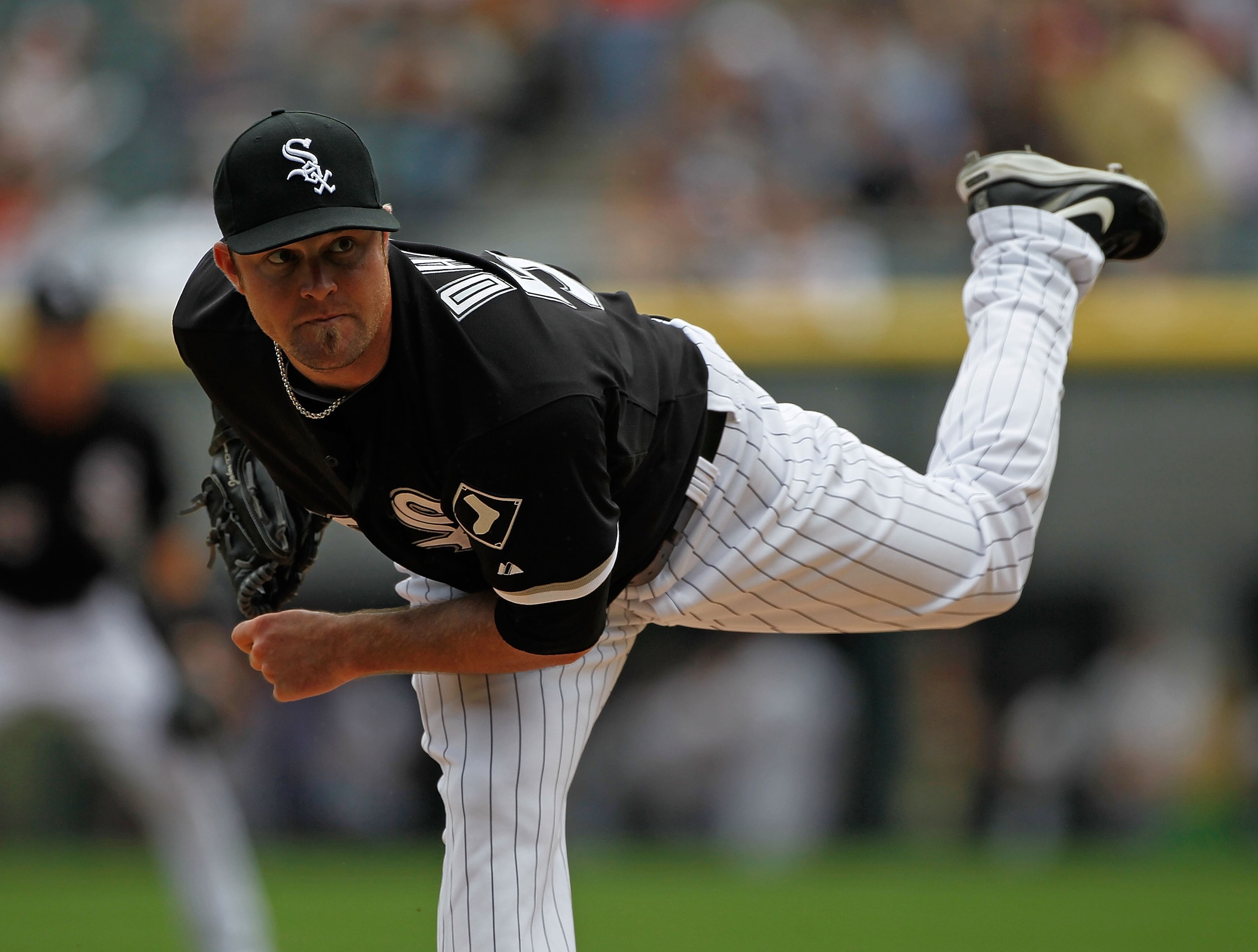 CHICAGO - JUNE 10: Starting pitcher John Danks #50 of the Chicago White Sox pitches against the Detriot Tigers at U.S. Cellular Field on June 10, 2010 in Chicago, Illinois. The White Sox defeated the Tigers 3-0. (Photo by Jonathan Daniel/Getty Images)