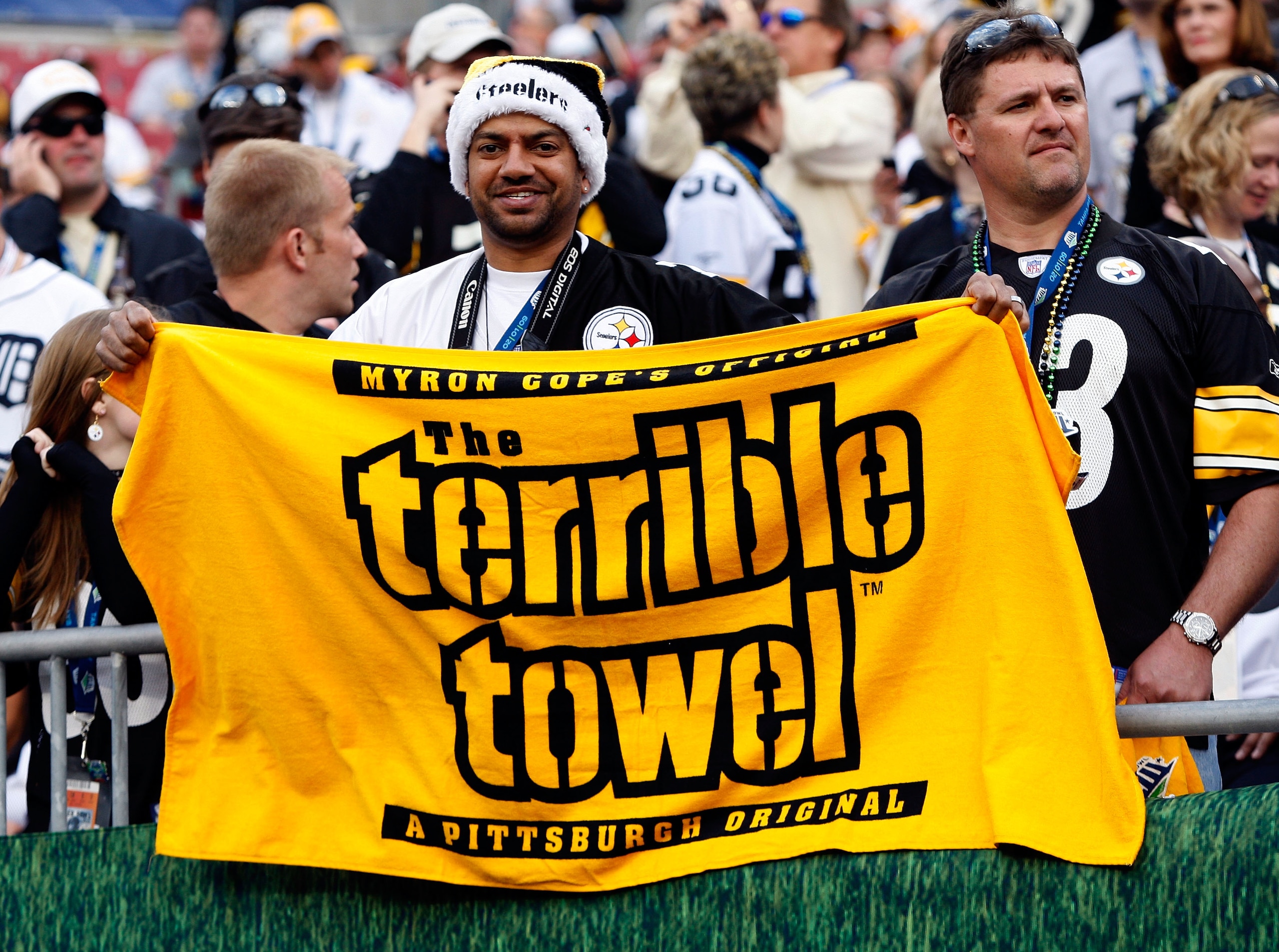TAMPA, FL - FEBRUARY 01:  A fan of the Pittsburgh Steelers displays a giant terrible towel against the Arizona Cardinals during Super Bowl XLIII on February 1, 2009 at Raymond James Stadium in Tampa, Florida.  (Photo by Jamie Squire/Getty Images)