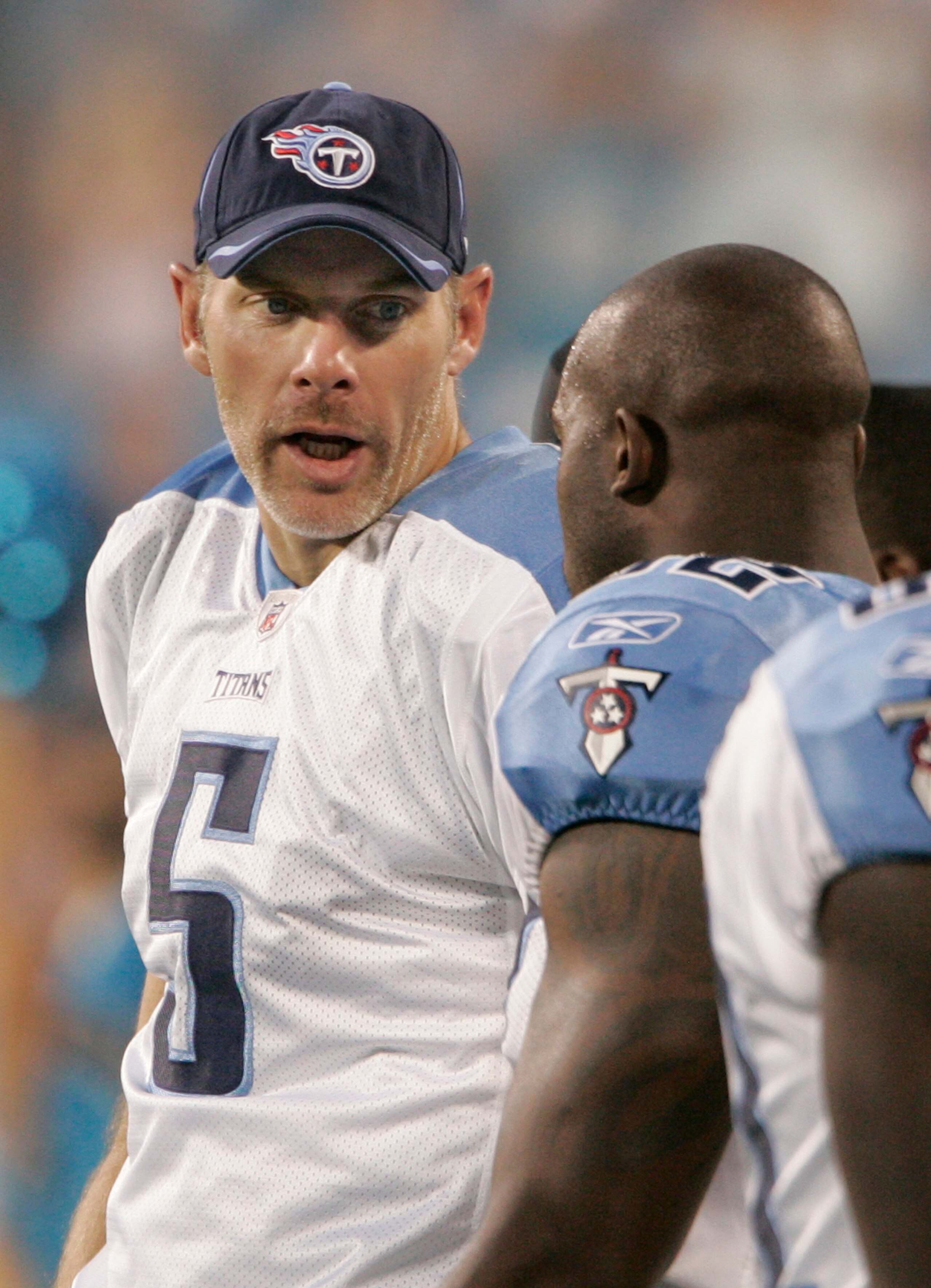CHARLOTTE, NC - AUGUST 28:  Quarterback Kerry Collins #5 of the Tennessee Titans talks to a teammate on the sideline  during their preseason game against the Carolina Panthers at Bank of America Stadium on August 28, 2010 in Charlotte, North Carolina. (Ph