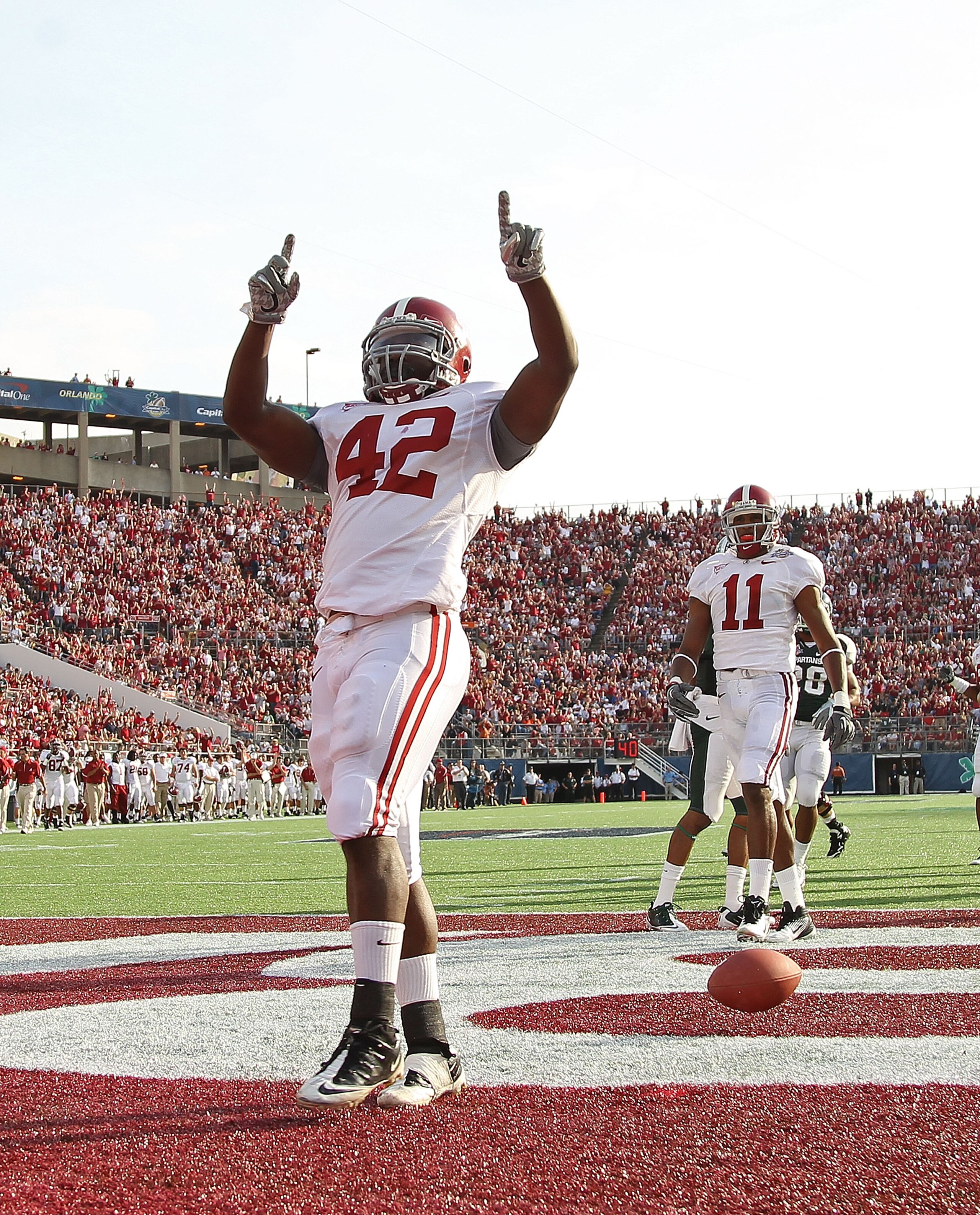 ORLANDO, FL - JANUARY 01:  Eddie Lacy #42 of the Alabama Crimson Tide celebrates after rushing for a touchdown during the Capitol One Bowl against the Michigan State Spartans at the Florida Citrus Bowl on January 1, 2011 in Orlando, Florida.  (Photo by Mi