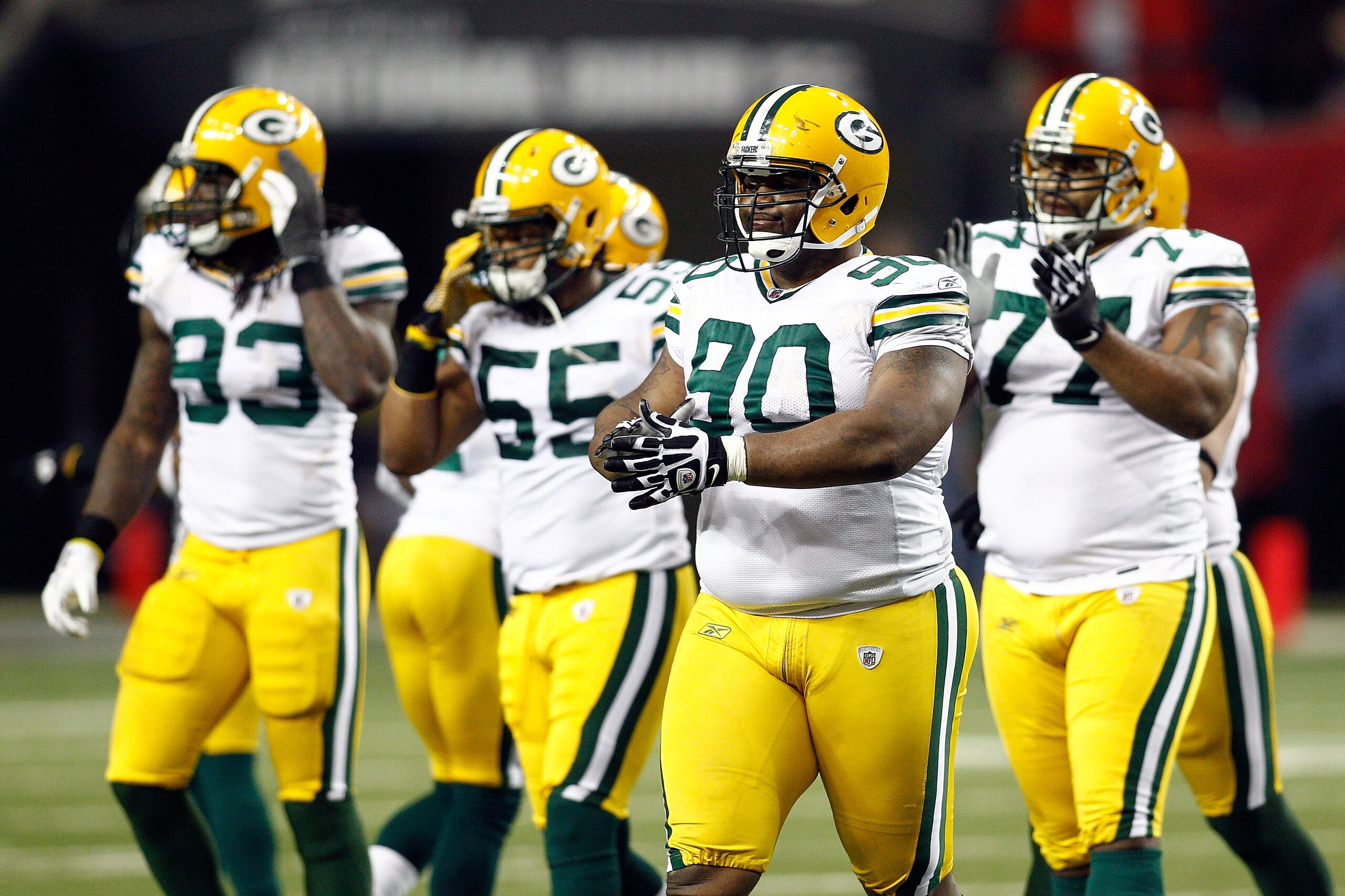 ATLANTA, GA - JANUARY 15:  (L-R) Erik Walden #93, Desmond Bishop #55, B.J. Raji #90 and Cullen Jenkins #77 of the Green Bay Packers walk towards the sideline against the Atlanta Falcons during their 2011 NFC divisional playoff game at Georgia Dome on Janu