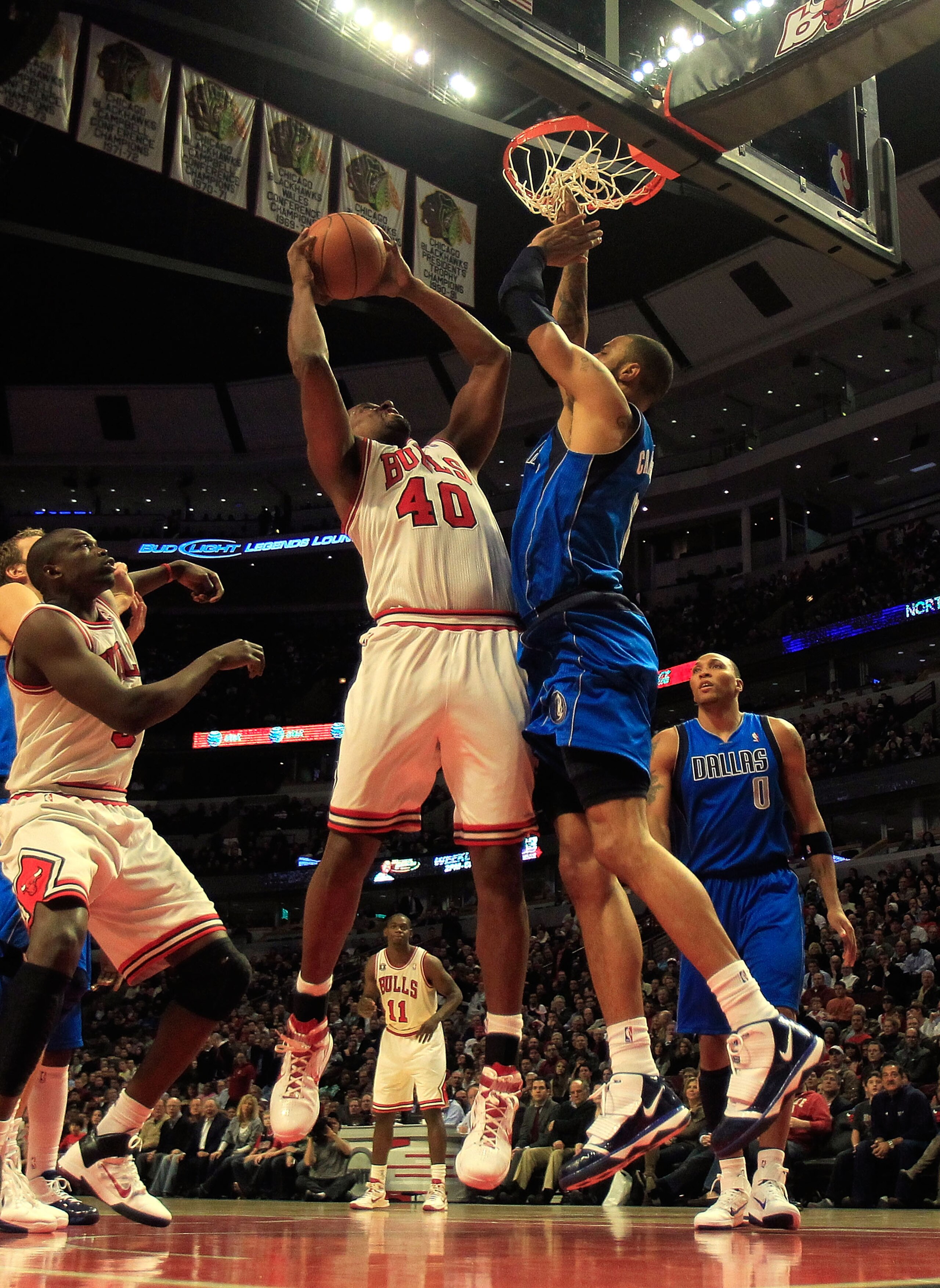 CHICAGO, IL - JANUARY 20: Kurt Thomas #40 of the Chicago Bulls goes up for a shot against Tyson Chandler #6 of the Dallas Mavericks at the United Center on January 20, 2011 in Chicago, Illinois. The Bulls defeated the Mavericks 82-77. NOTE TO USER: User e