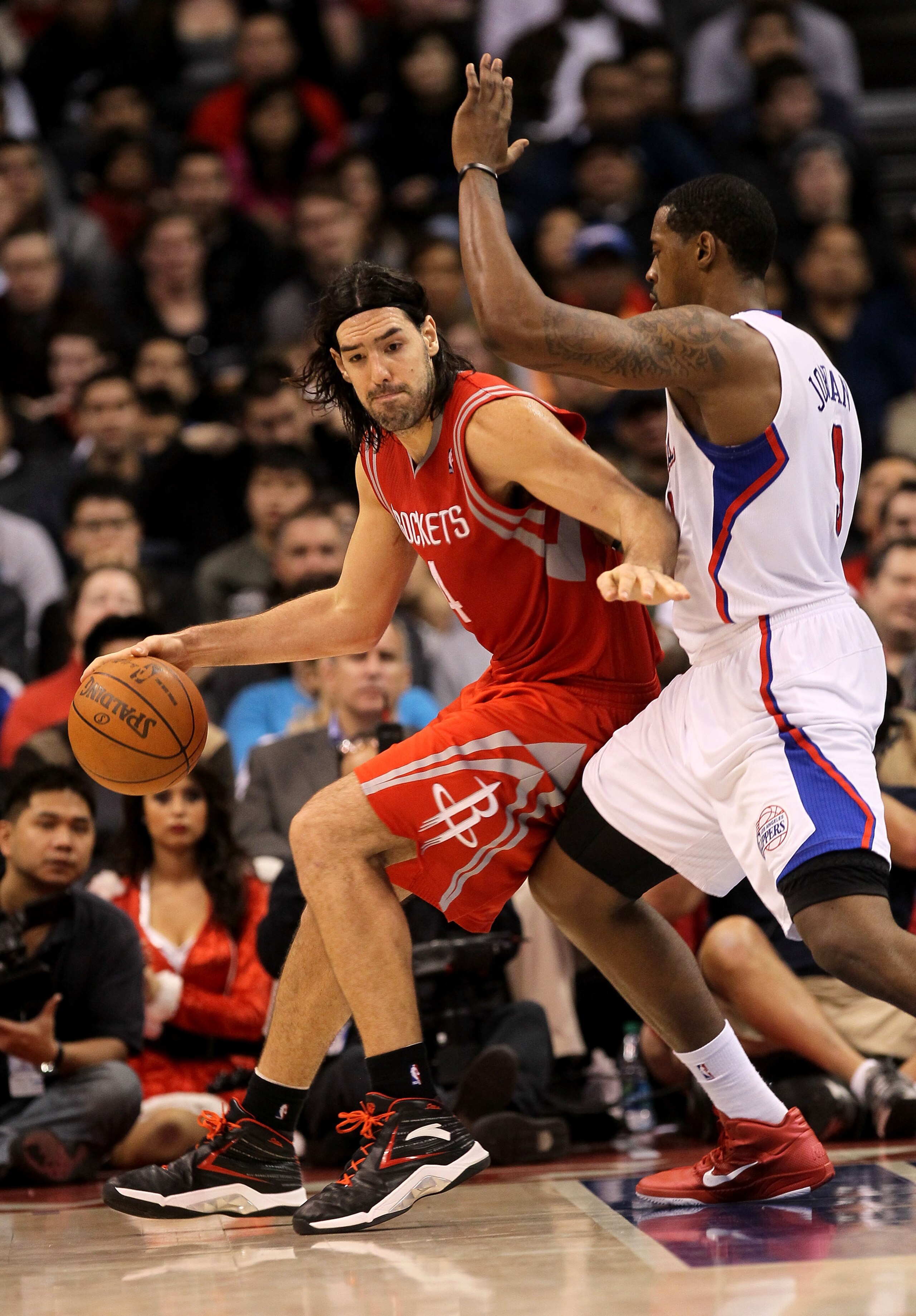 LOS ANGELES, CA - DECEMBER 22:  Luis Scola #4 of the Houston Rockets controls the ball against DeAndre Jordan #9 of the Los Angeles Clippers at Staples Center on December 22, 2010 in Los Angeles, California.  The Rockets won 97-92. NOTE TO USER: User expr