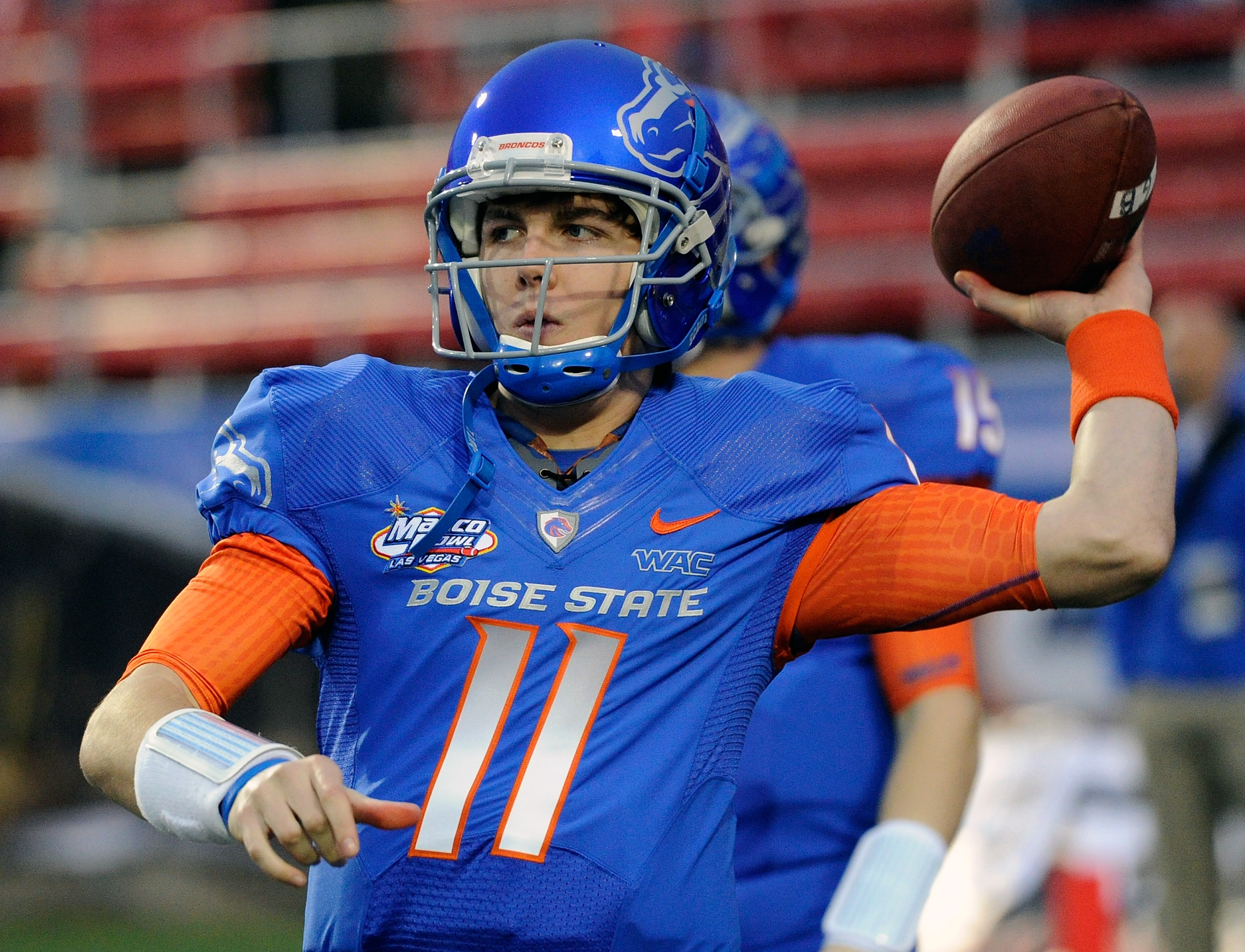 LAS VEGAS, NV - DECEMBER 22:  Quarterback Kellen Moore #11 of the Boise State Broncos warms up before playing against the Utah Utes in the MAACO Bowl Las Vegas at Sam Boyd Stadium December 22, 2010 in Las Vegas, Nevada. Boise State Won 26-3.  (Photo by Et