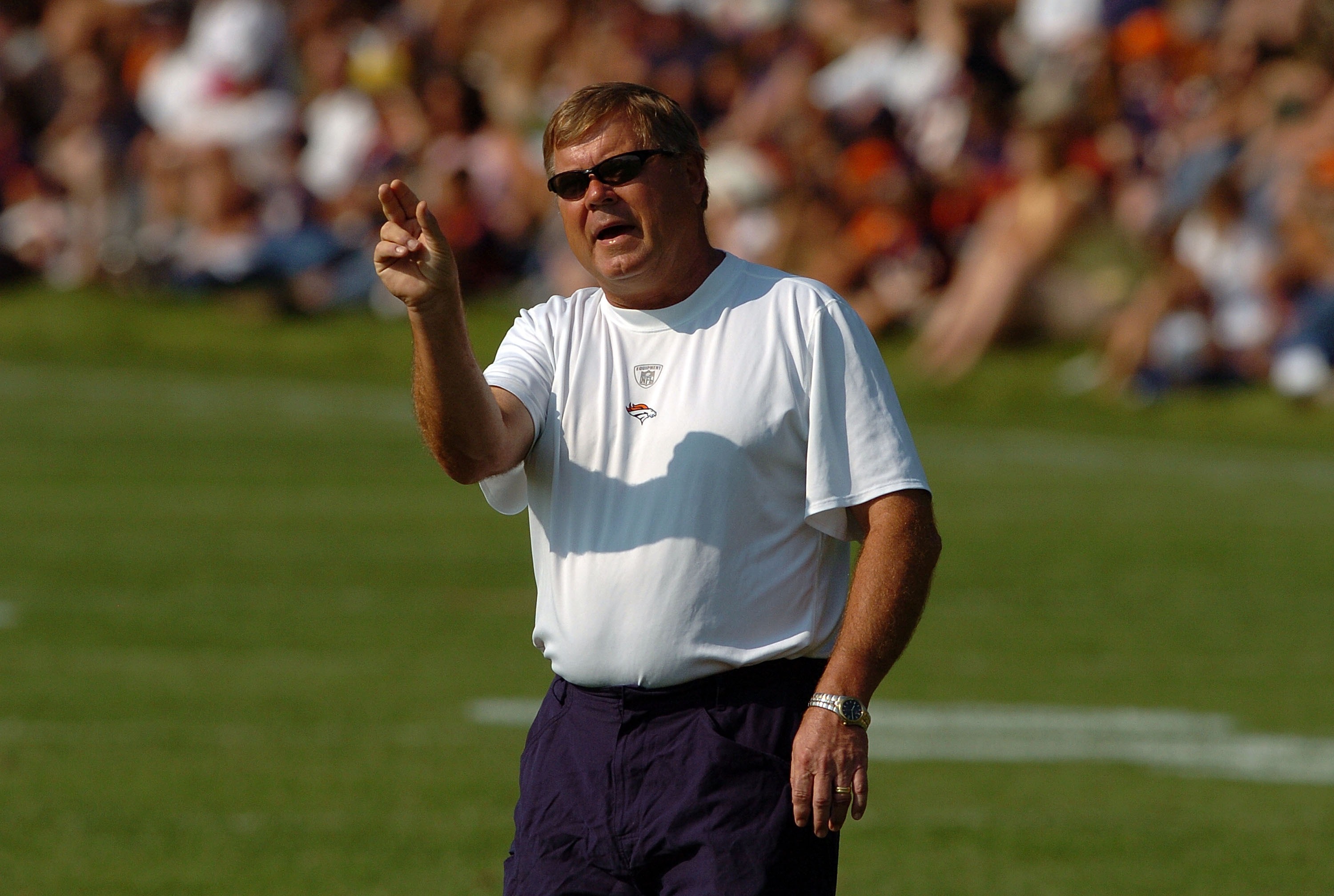 ENGLEWOOD, CO - JULY 31: Assistant Head Coach/Quarterbacks Mike Heimerdinger yells out instructions during workouts at training camp on July 31, 2007 at the Paul D. Bowlen Memorial Broncos Centre in Englewood, Colorado. (Photo by Steve Dykes/Getty Ima