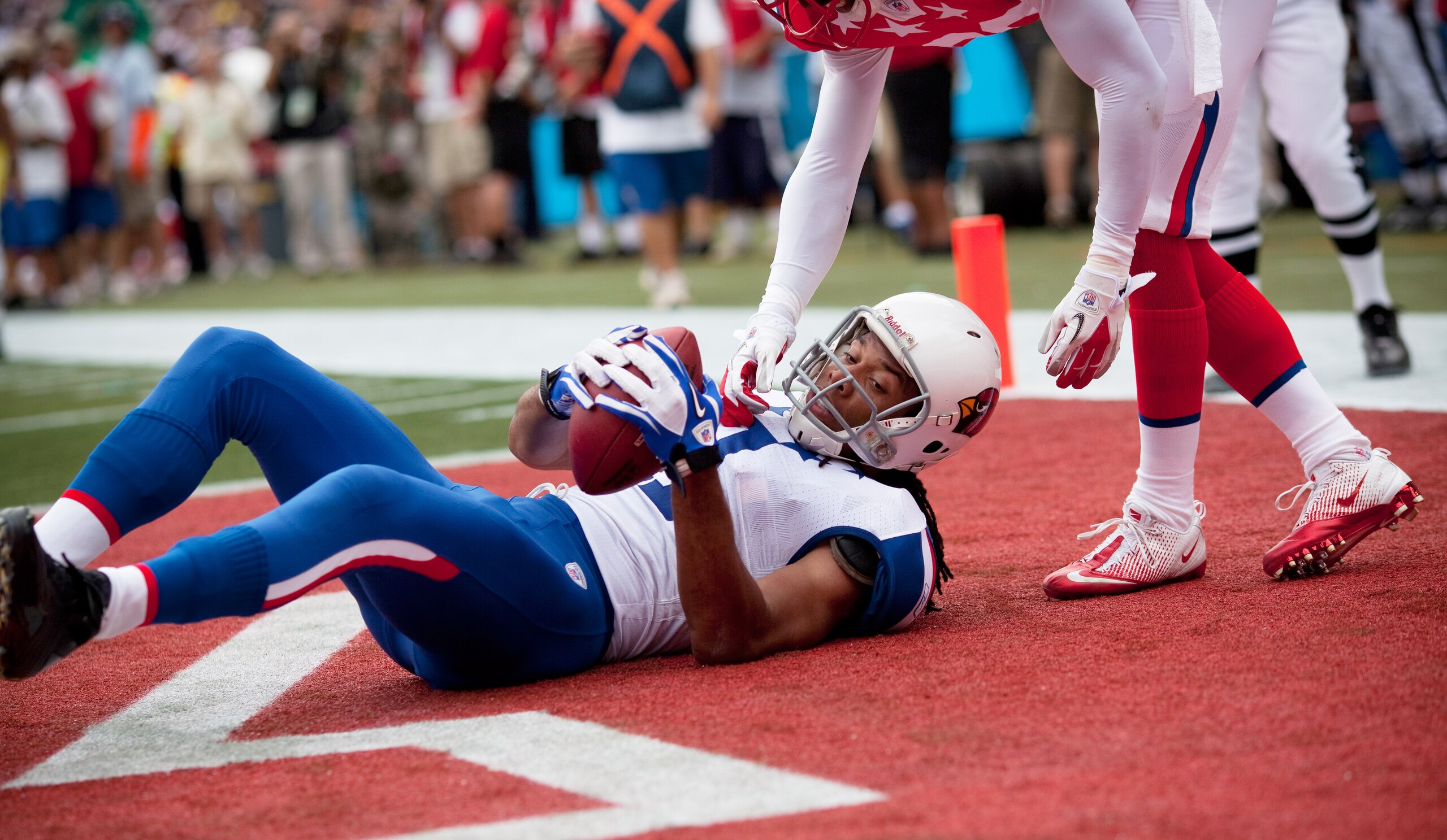 HONOLULU - JANUARY 30: Larry Fitzgerald #11 of the Arizona Cardinals after scoring a touchdown against the American Football Conference (AFC) during the 2011 NFL Pro Bowl at Aloha Stadium on January 30, 2011 in Honolulu, Hawaii.  (Photo by Kent Nishimura/