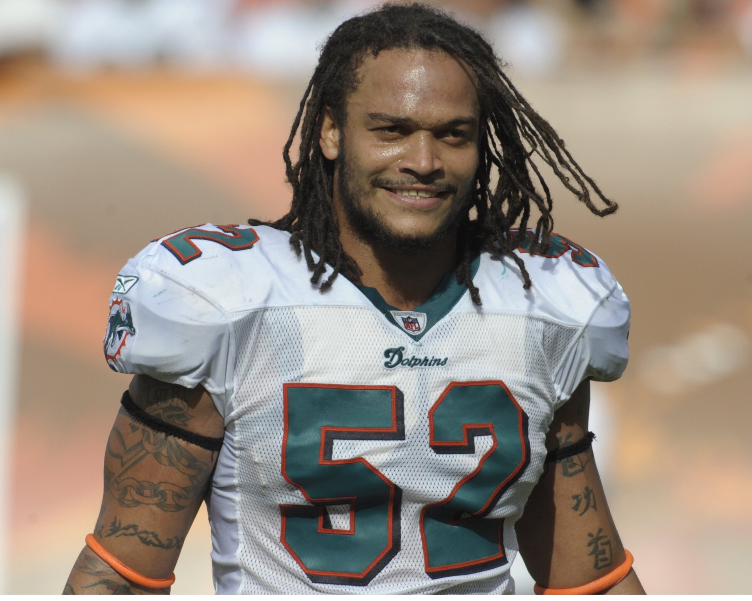 MIAMI, FL - JANUARY 4:  Linebacker Channing Crowder #52 of the Miami Dolphins sets for play against the Baltimore Ravens in an NFL Wildcard Playoff Game at Dolphins Stadium on January 4, 2009 in Miami, Florida.  (Photo by Al Messerschmidt/Getty Images)