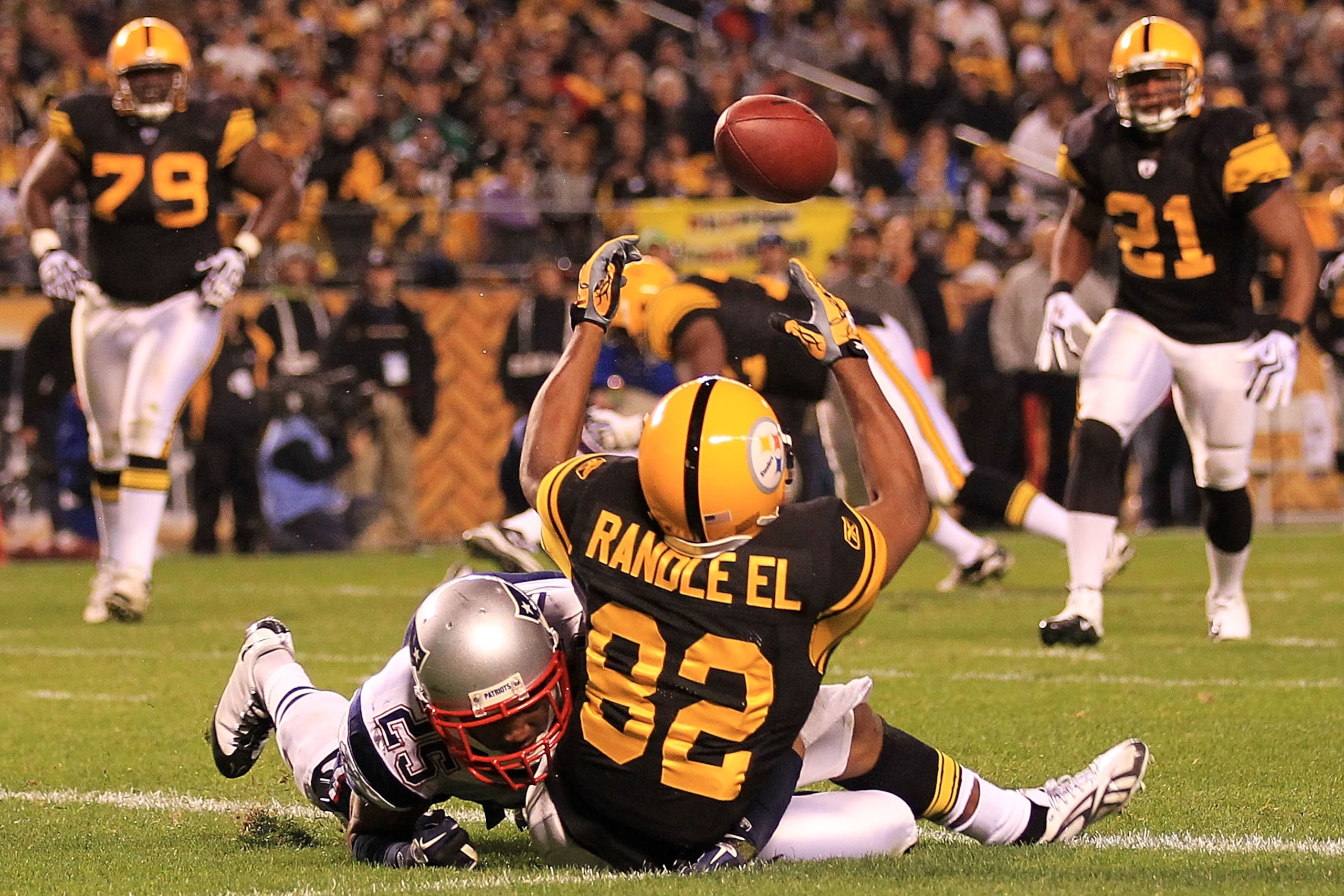 PITTSBURGH - NOVEMBER 14:  Antwaan Randle El #82 of the Pittsburgh Steelers fumbles a catch in the endzone under pressure from Patrick Chung #25 of the New England Patriots on November 14, 2010 at Heinz Field in Pittsburgh, Pennsylvania.  (Photo by Chris