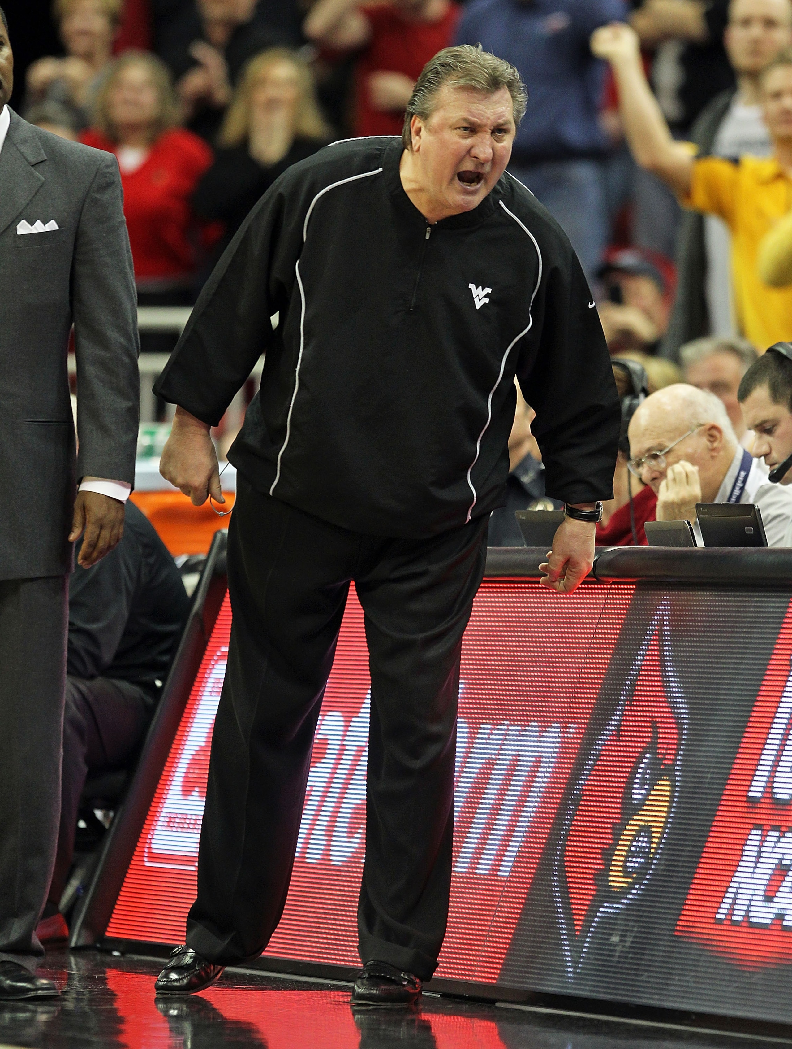 LOUISVILLE, KY - JANUARY 26:  Bob Huggins the Head Coach of the West Virginia Mountaineers screams at a game offical after earning a techical foul during the Big East Conference game against the Louisville Cardinals at the KFC Yum! Center on January 26, 2