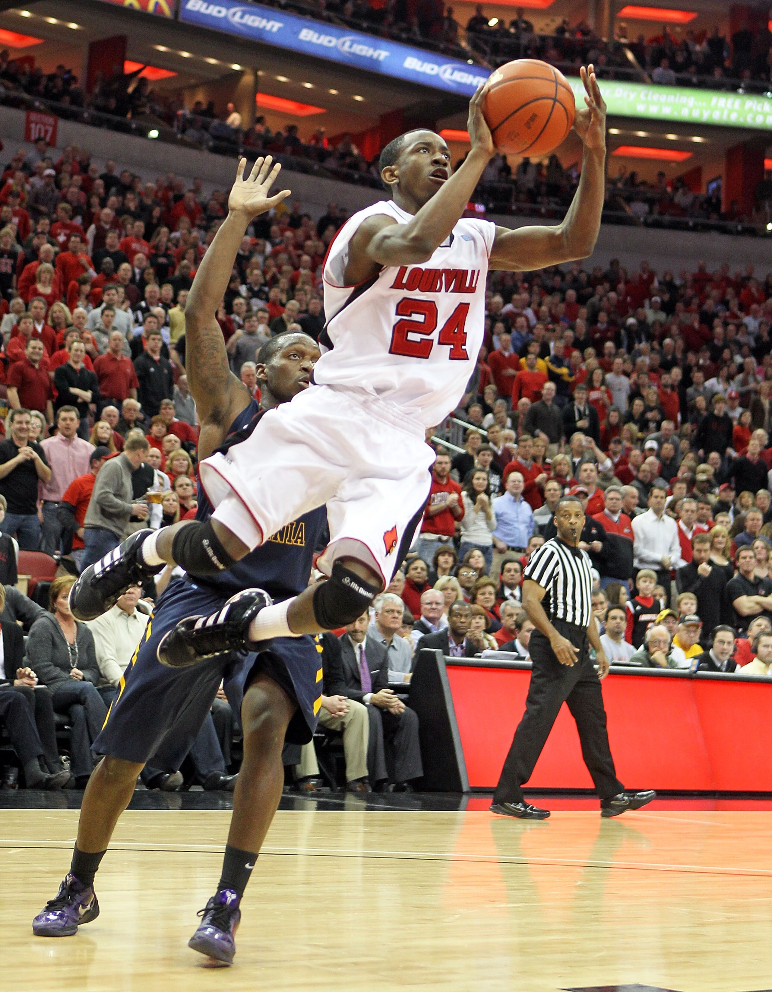 LOUISVILLE, KY - JANUARY 26: Russ Smith #24 of the Louisville Cardinals shoots the ball during the Big East Conference game against the West Virginia Mountaineers at the KFC Yum! Center on January 26, 2011 in Louisville, Kentucky.  (Photo by Andy Lyons/Ge