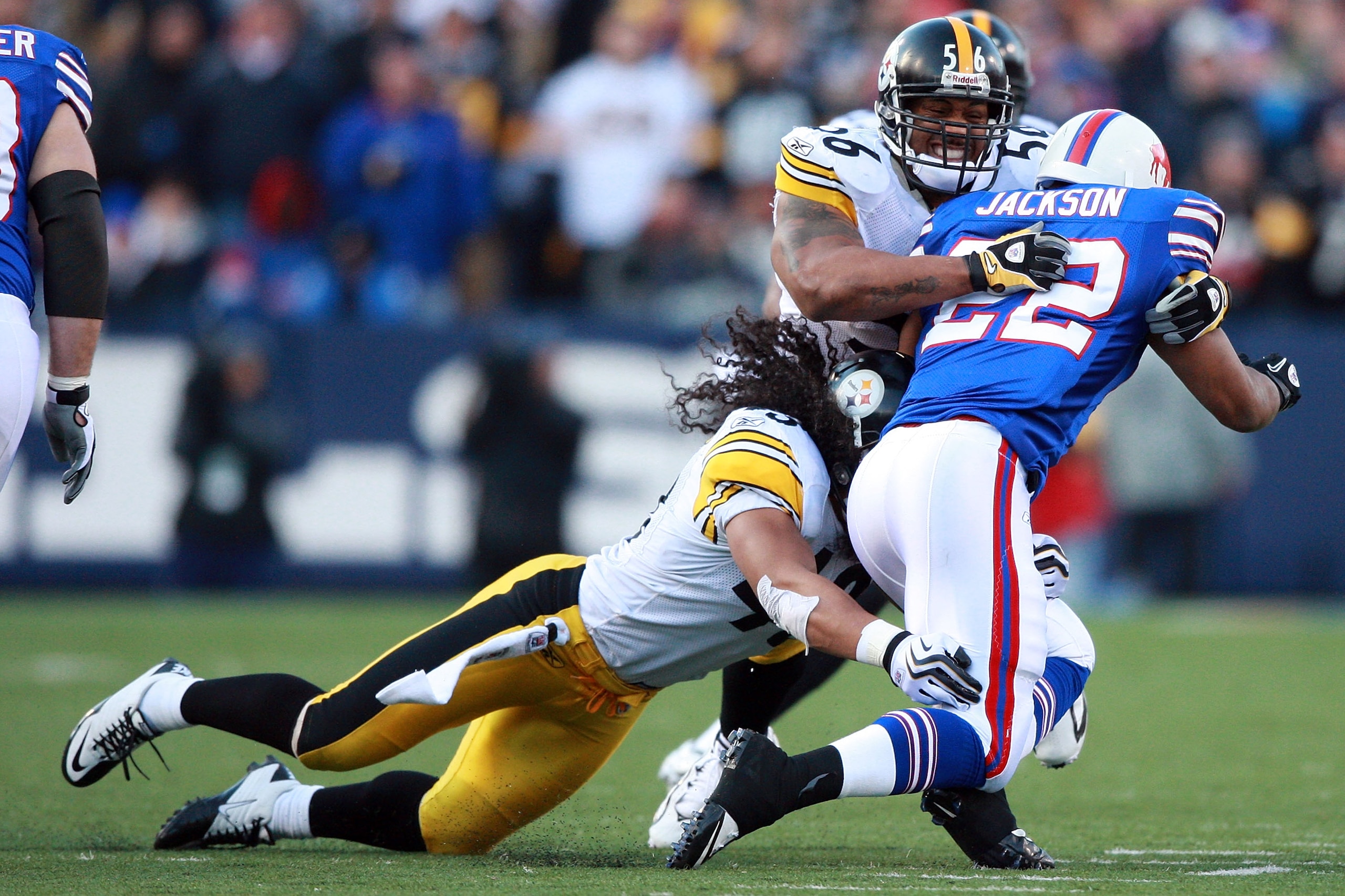 ORCHARD PARK, NY - NOVEMBER 28:  Troy Polamalu #43 and Lamarr Woodley #56 of the Pittsburgh Steelers tackle Fred Jackson #22 of the Buffalo Bills during their game at Ralph Wilson Stadium on November 28, 2010 in Orchard Park, New York.  (Photo by Karl Wal