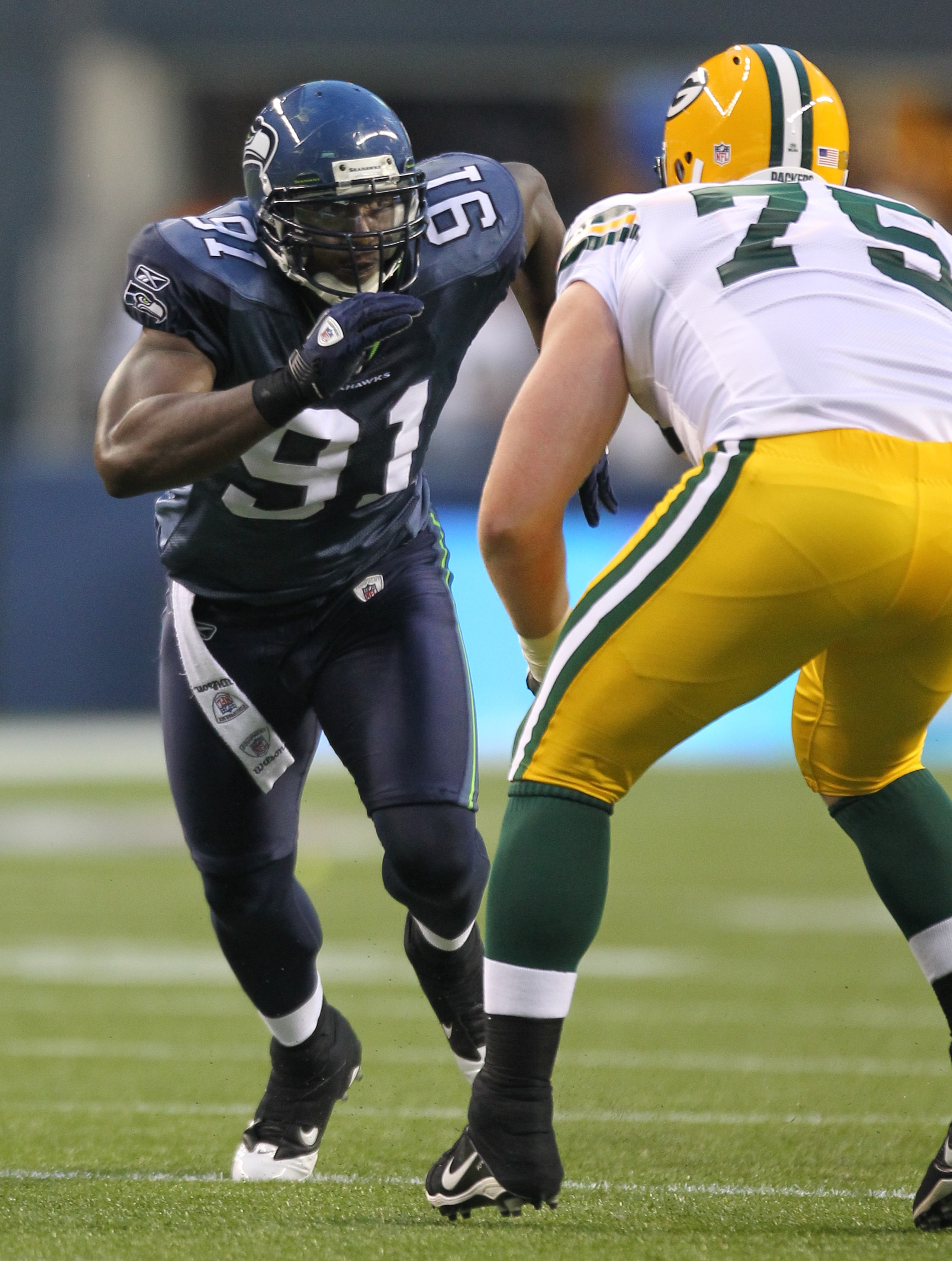 SEATTLE - AUGUST 21:  Defensive end Chris Clemons #91 of the Seattle Seahawks battles Bryan Bulaga #75 during the preseason game against the Green Bay Packers at Qwest Field on August 21, 2010 in Seattle, Washington. (Photo by Otto Greule Jr/Getty Images)