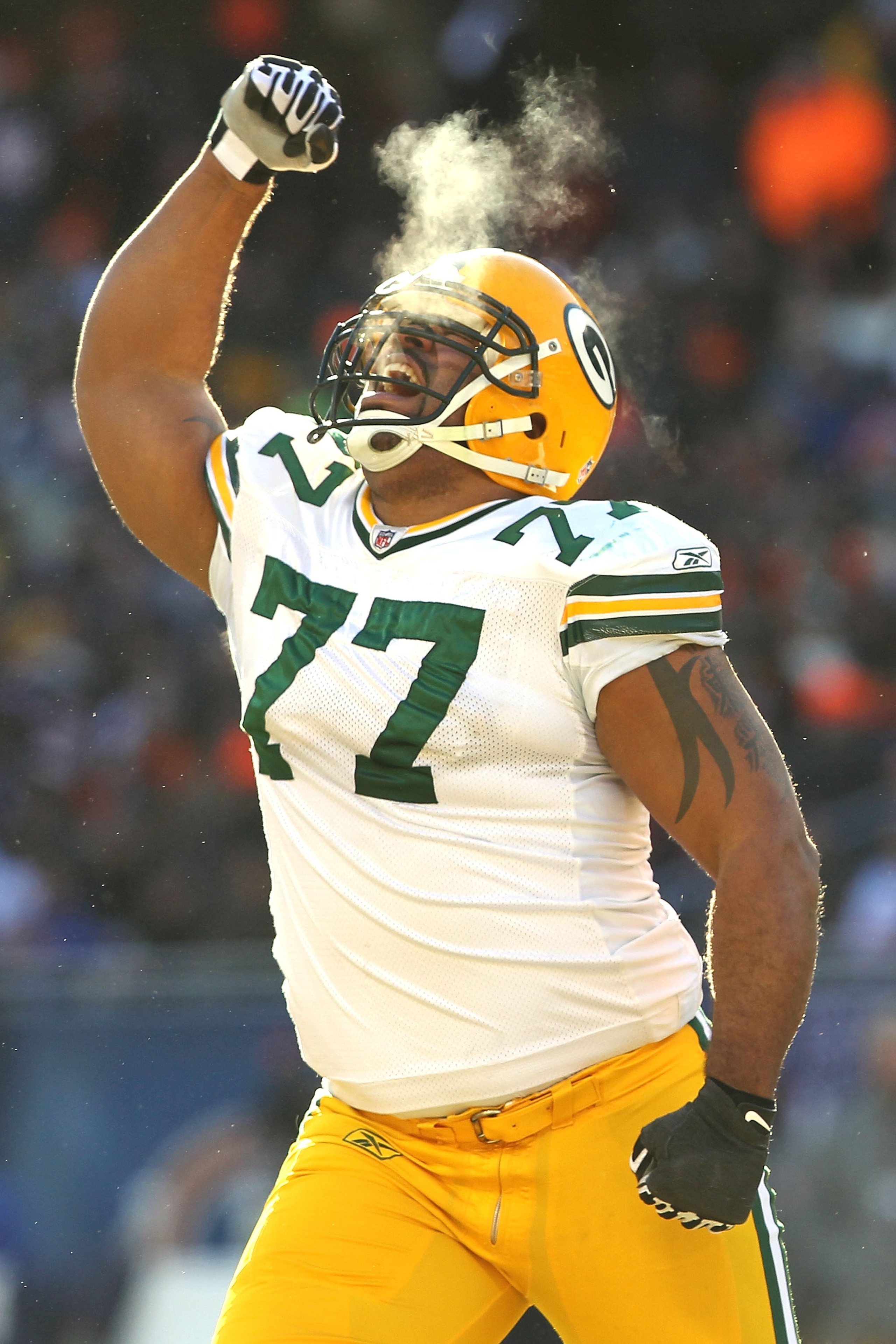 CHICAGO, IL - JANUARY 23:  Cullen Jenkins #77 of the Green Bay Packers reacts after a sack of quarterback Jay Cutler #6 of the Chicago Bears in the first half in the NFC Championship Game at Soldier Field on January 23, 2011 in Chicago, Illinois.  (Photo