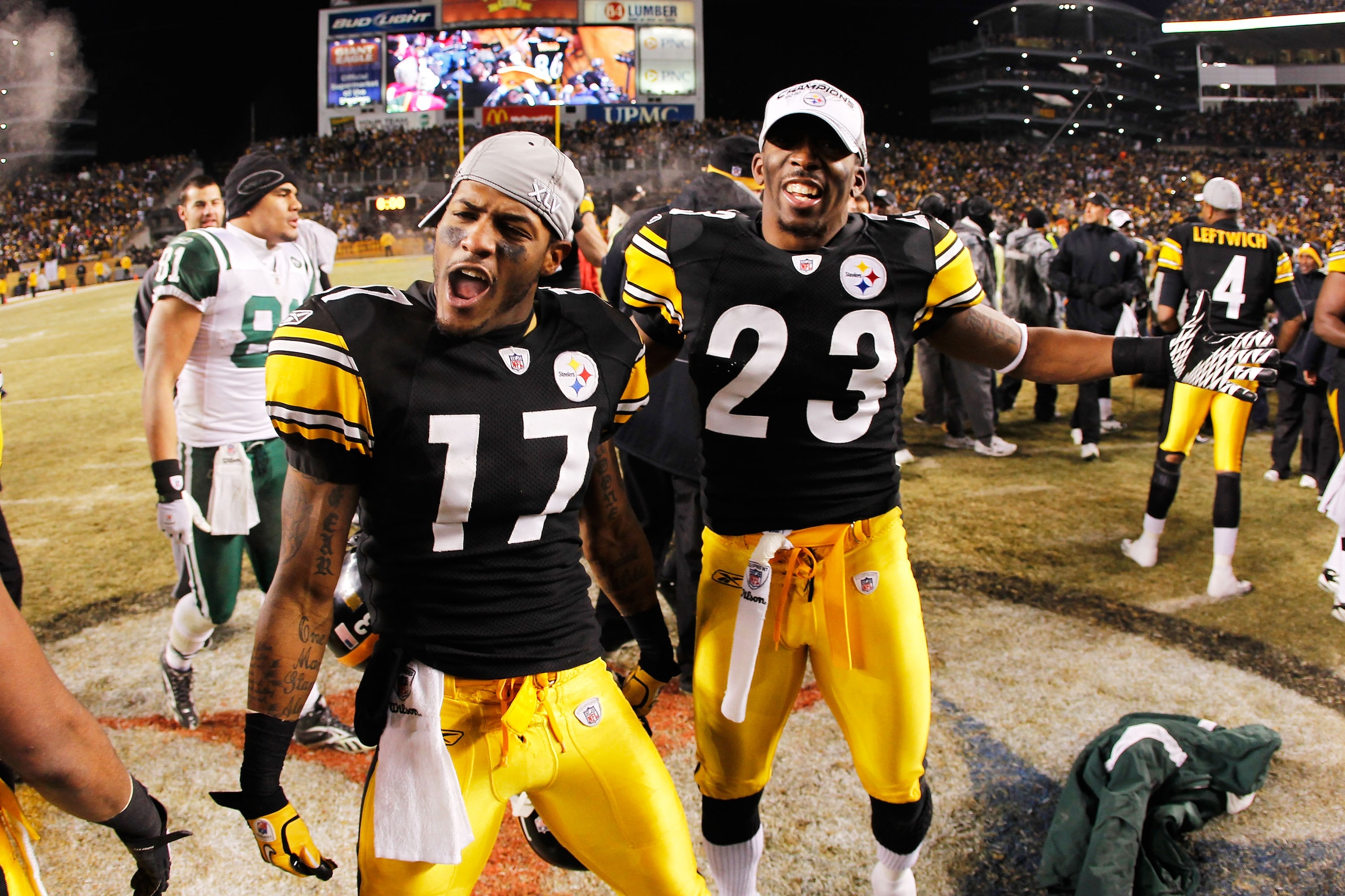 PITTSBURGH, PA - JANUARY 23:  Mike Wallace #17 and Keenan Lewis #23 of the Pittsburgh Steelers celebrate their 24 to 19 win over the New York Jets in the 2011 AFC Championship game at Heinz Field on January 23, 2011 in Pittsburgh, Pennsylvania.  (Photo by