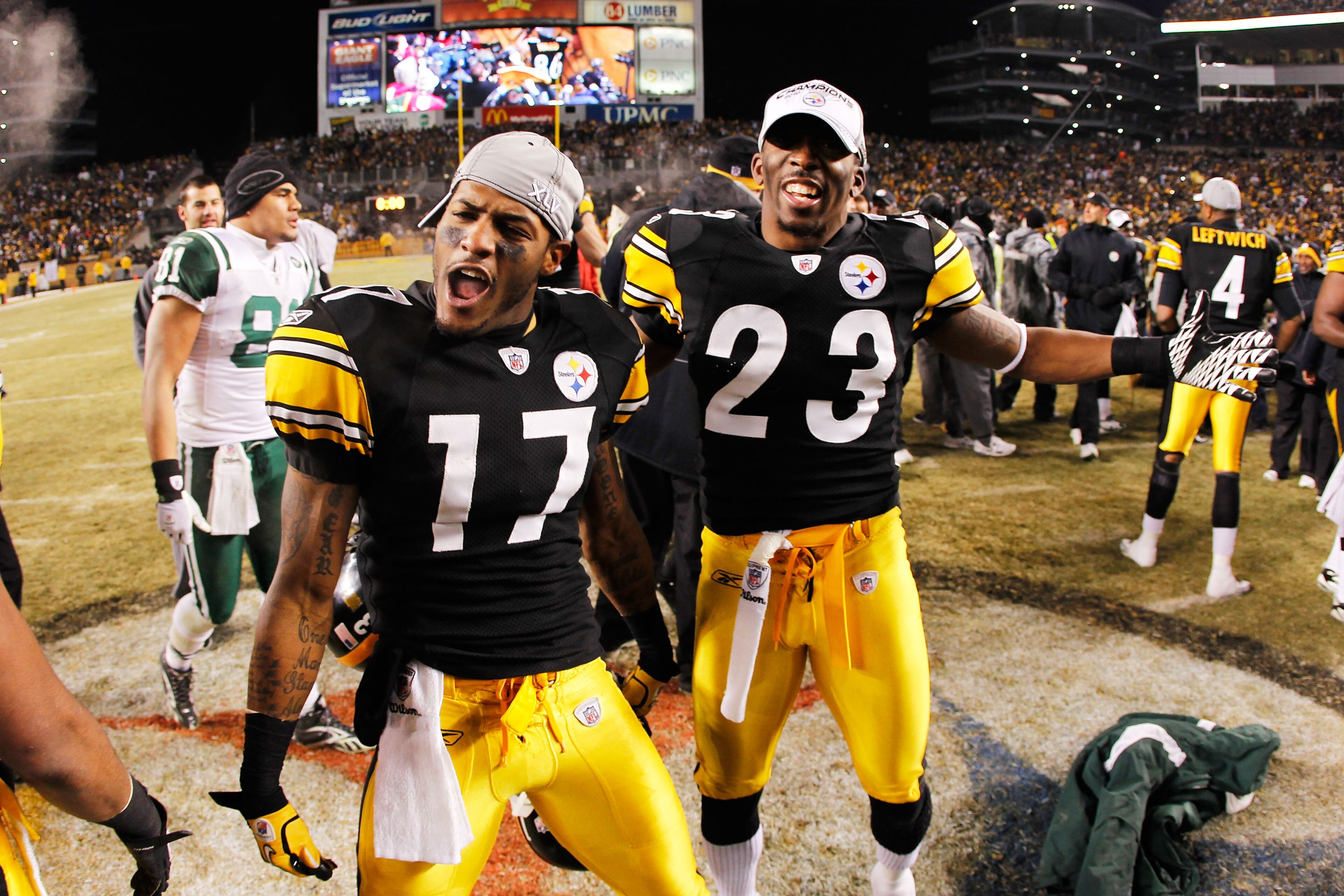 PITTSBURGH, PA - JANUARY 23:  Mike Wallace #17 and Keenan Lewis #23 of the Pittsburgh Steelers celebrate their 24 to 19 win over the New York Jets in the 2011 AFC Championship game at Heinz Field on January 23, 2011 in Pittsburgh, Pennsylvania.  (Photo by