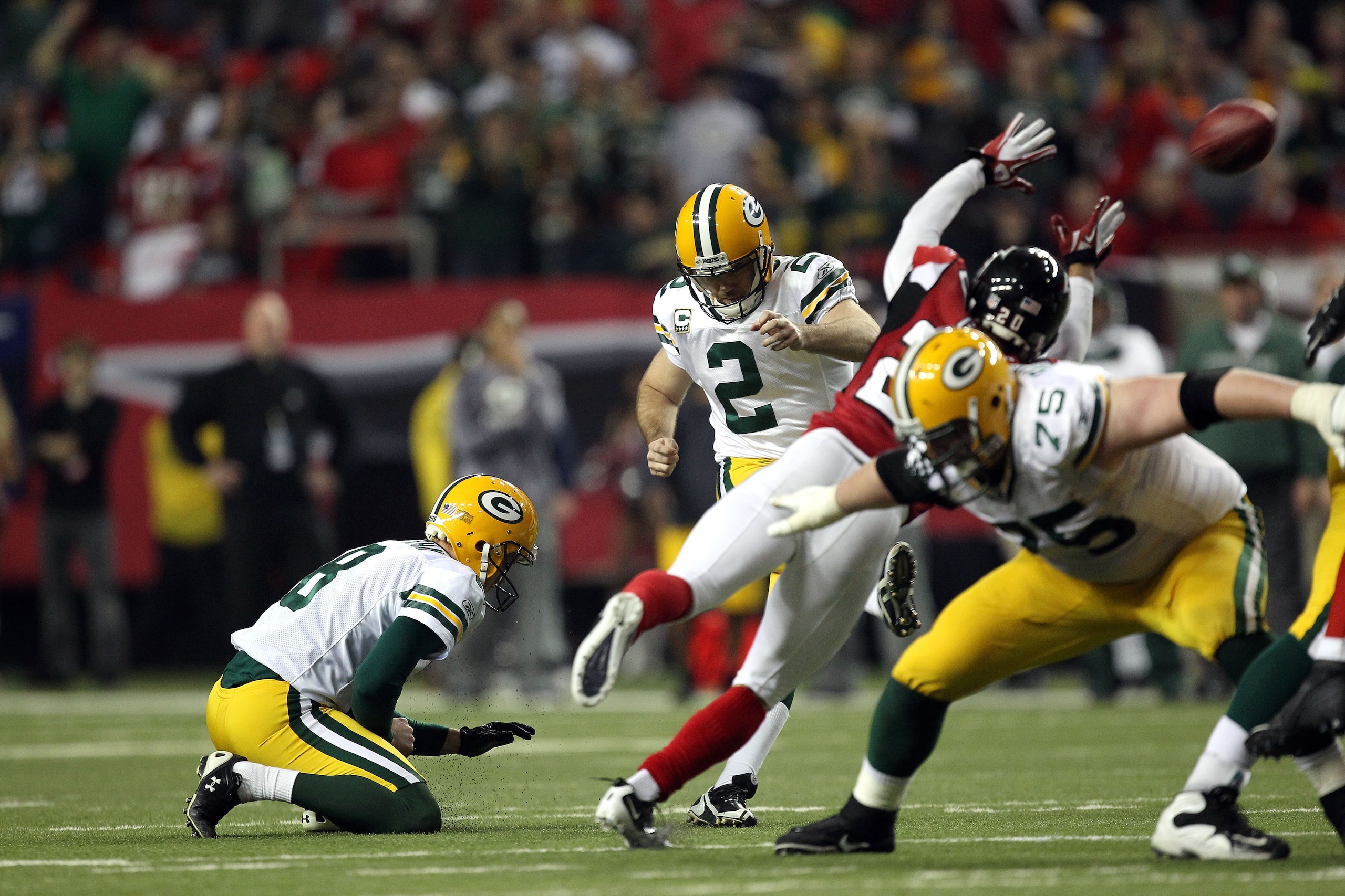 ATLANTA, GA - JANUARY 15:  Mason Crosby #2 of the Green Bay Packers kicks a successful field goal in the seocnd half against the Atlanta Falcons during their 2011 NFC divisional playoff game at Georgia Dome on January 15, 2011 in Atlanta, Georgia.  (Photo