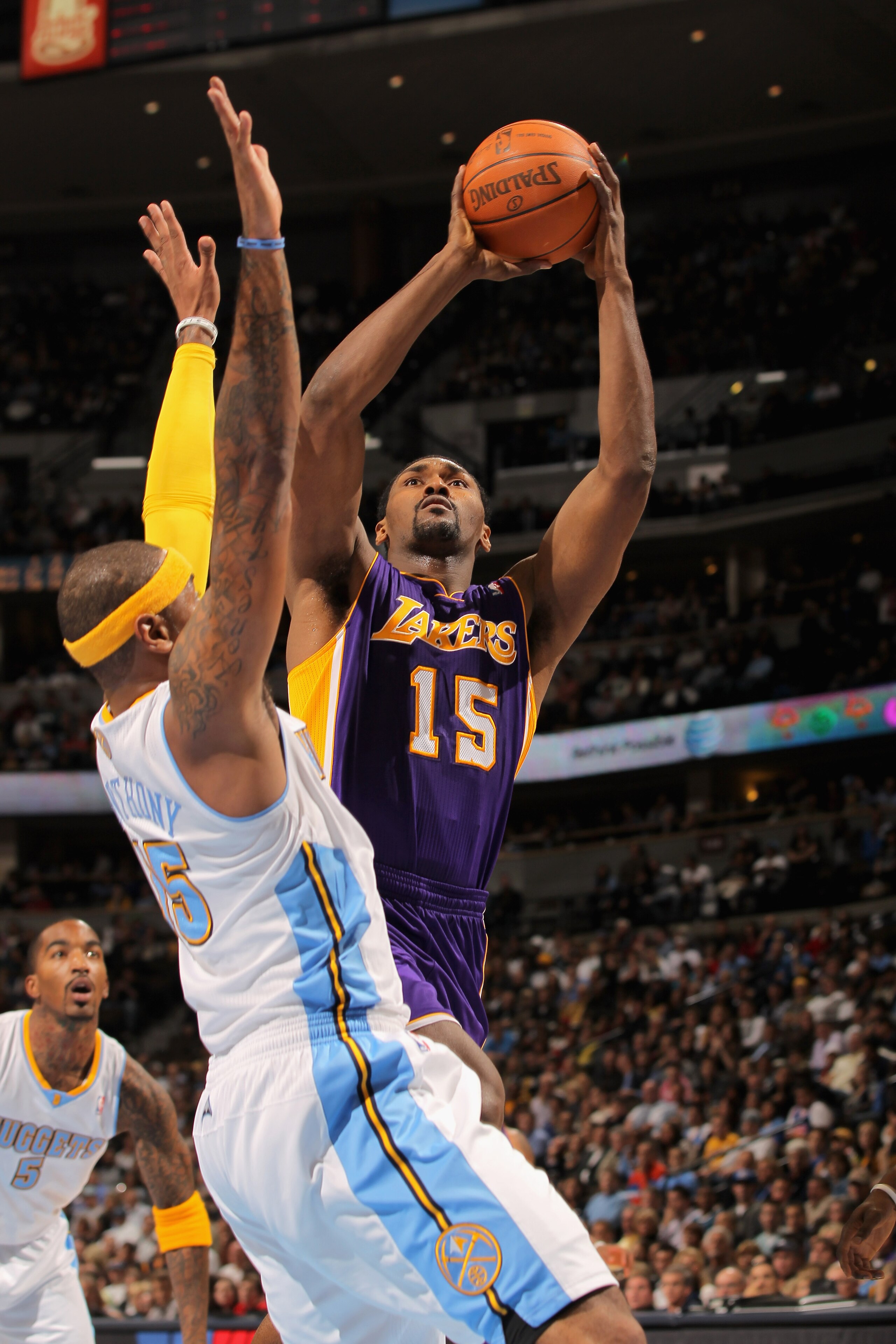 DENVER - NOVEMBER 11: Ron Artest #15 of the Los Angeles Lakers takes a shot over Al Harrington #7 of the Denver Nuggets at the Pepsi Center on November 11, 2010 in Denver, Colorado. The Nuggets defeated the Lakers 118-112. NOTE TO USER: User expressly a DENVER - NOVEMBER 11: Ron Artest #15 of the Los Angeles Lakers takes a shot over Al Harrington #7 of the Denver Nuggets at the Pepsi Center on November 11, 2010 in Denver, Colorado. The Nuggets defeated the Lakers 118-112. NOTE TO USER: User expressly a