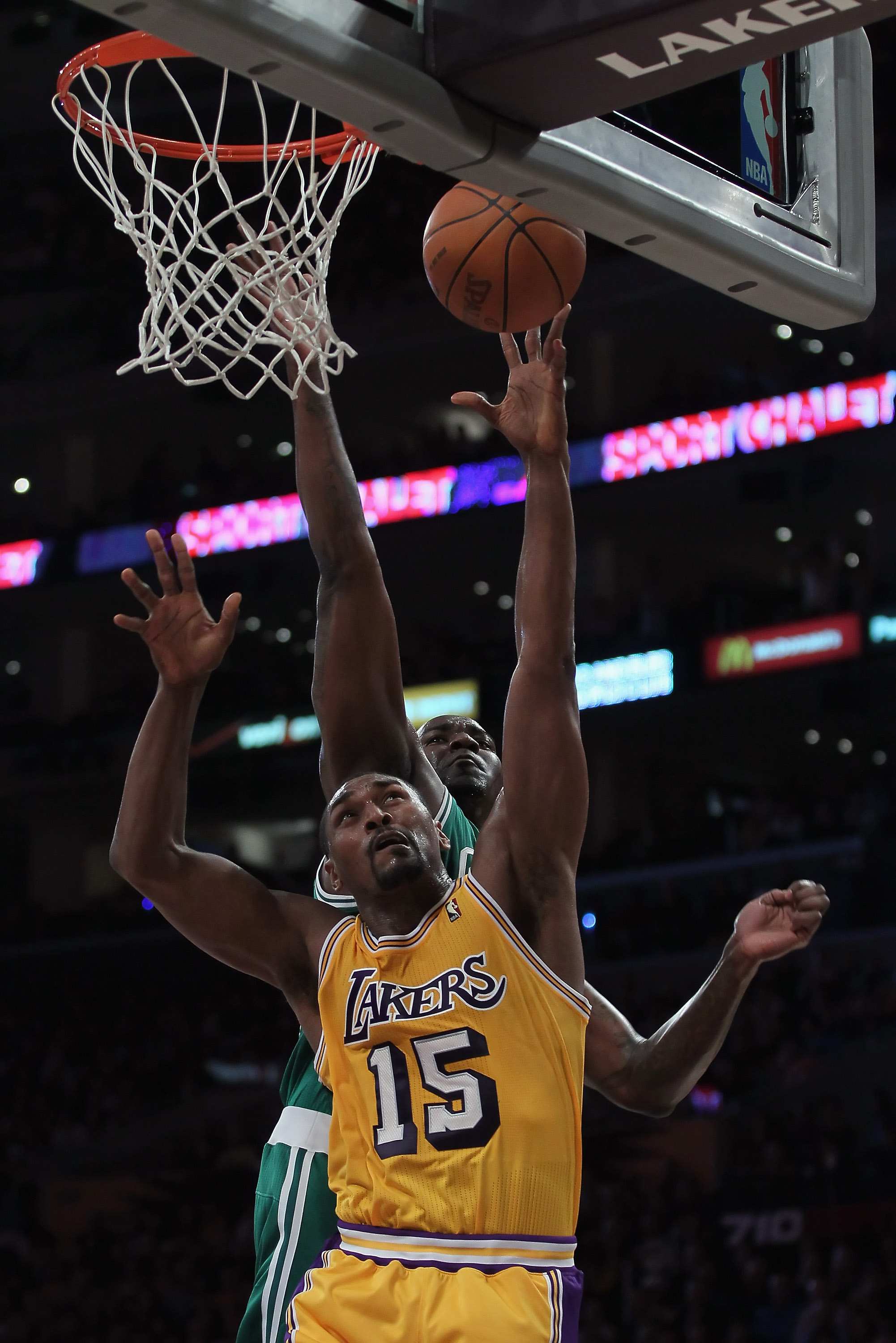 LOS ANGELES, CA - JANUARY 30:  Ron Artest #15 of the Los Angeles Lakers and Kendrick Perkins #43 of the Boston Celtics fight for a rebound in the first half at Staples Center on January 30, 2011 in Los Angeles, California.  (Photo by Jeff Gross/Getty Imag