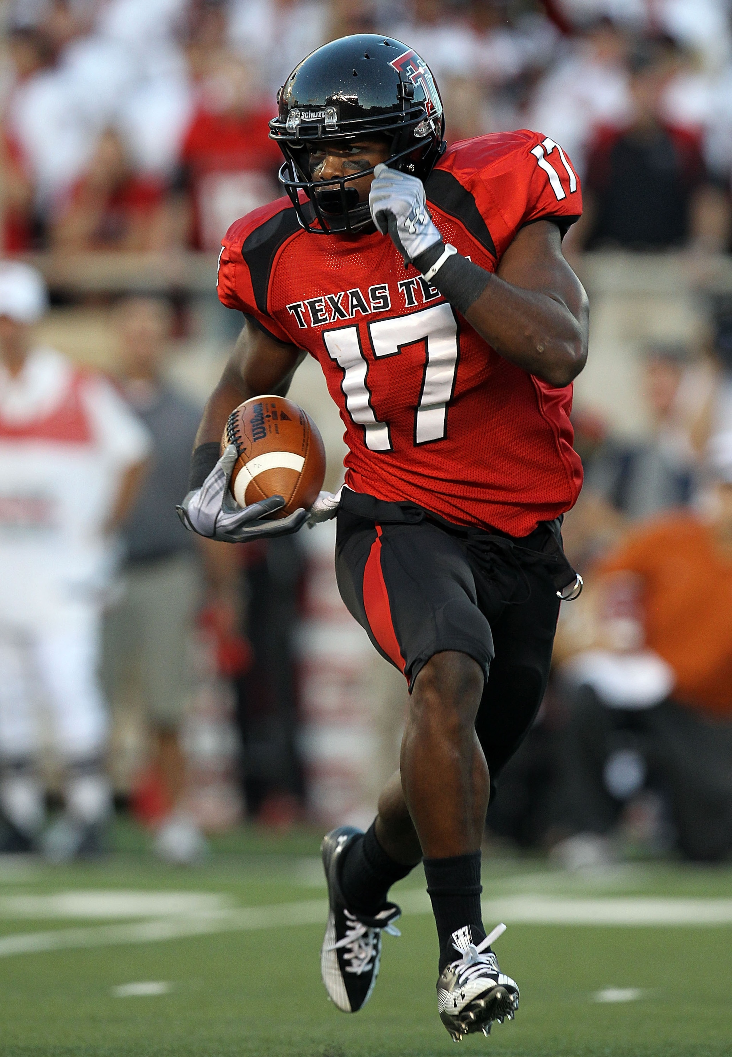 LUBBOCK, TX - SEPTEMBER 18:  Detron Lewis #17 of the Texas Tech Red Raiders runs the ball against the Texas Longhorns at Jones AT&T Stadium on September 18, 2010 in Lubbock, Texas.  (Photo by Ronald Martinez/Getty Images)