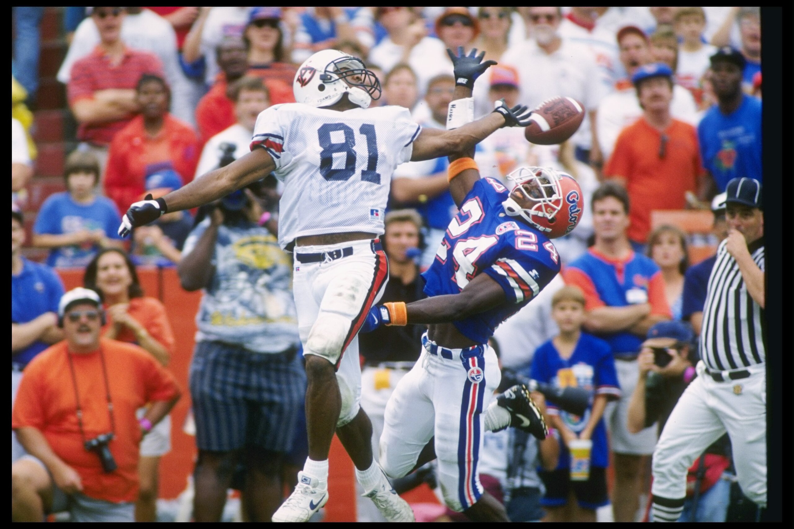 15 Oct 1994: Wide receiver Frank Sanders of the Auburn Tigers and defensive back Dell McGee of the Florida Gators jump for the ball during a game at Florida Field in Gainesville, Florida. Auburn won the game 36-33. Mandatory Credit: Scott Halleran /All 15 Oct 1994: Wide receiver Frank Sanders of the Auburn Tigers and defensive back Dell McGee of the Florida Gators jump for the ball during a game at Florida Field in Gainesville, Florida. Auburn won the game 36-33. Mandatory Credit: Scott Halleran /All