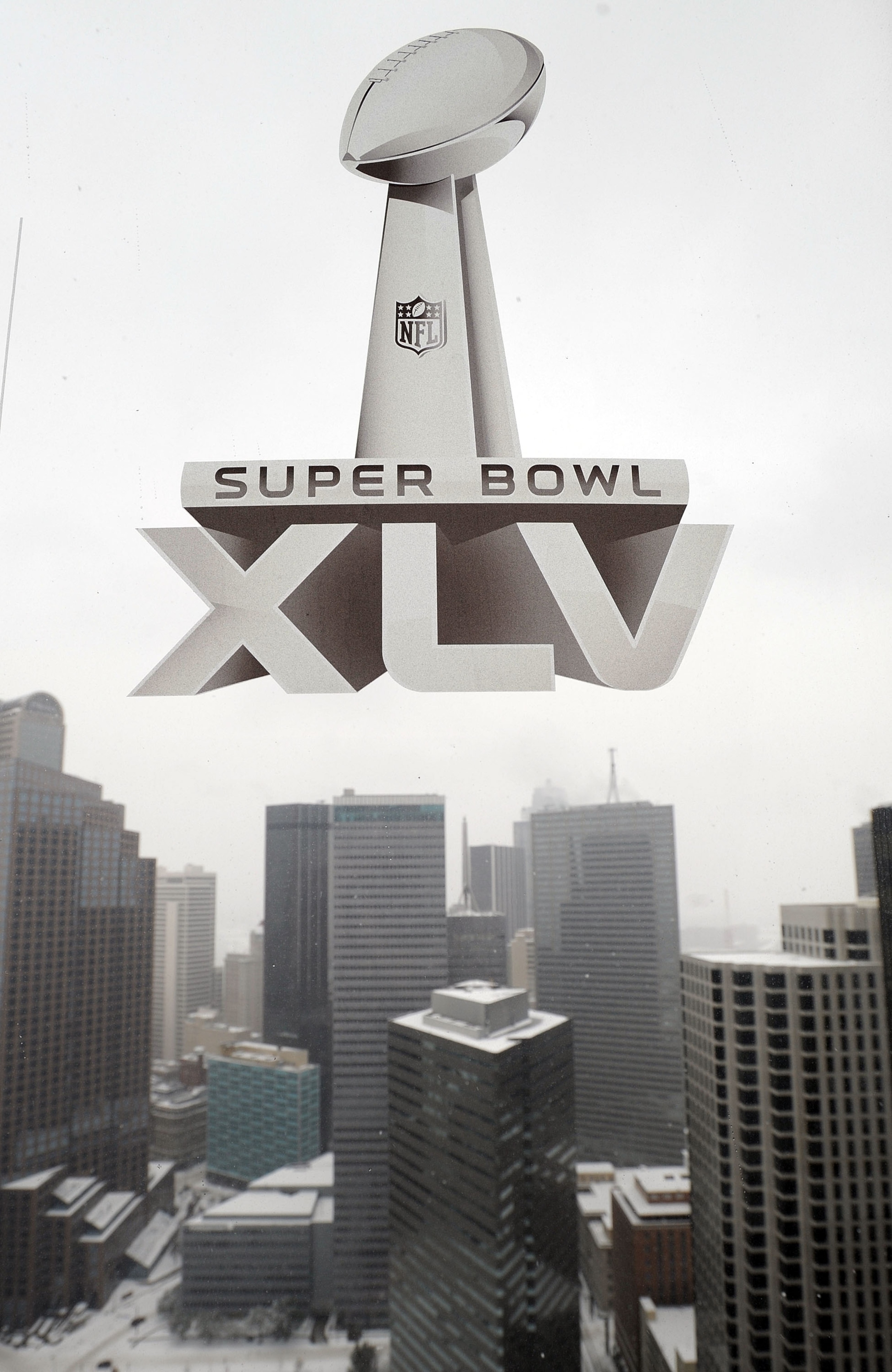 DALLAS, TX - FEBRUARY 04:  A Super Bowl XLV sticker hangs on a window overlooking downtown on February 4, 2011 in Dallas, Texas. More than four inches of snow fell overnight in the North Texas area. The Green Bay Packers will play the Pittsburgh Steelers