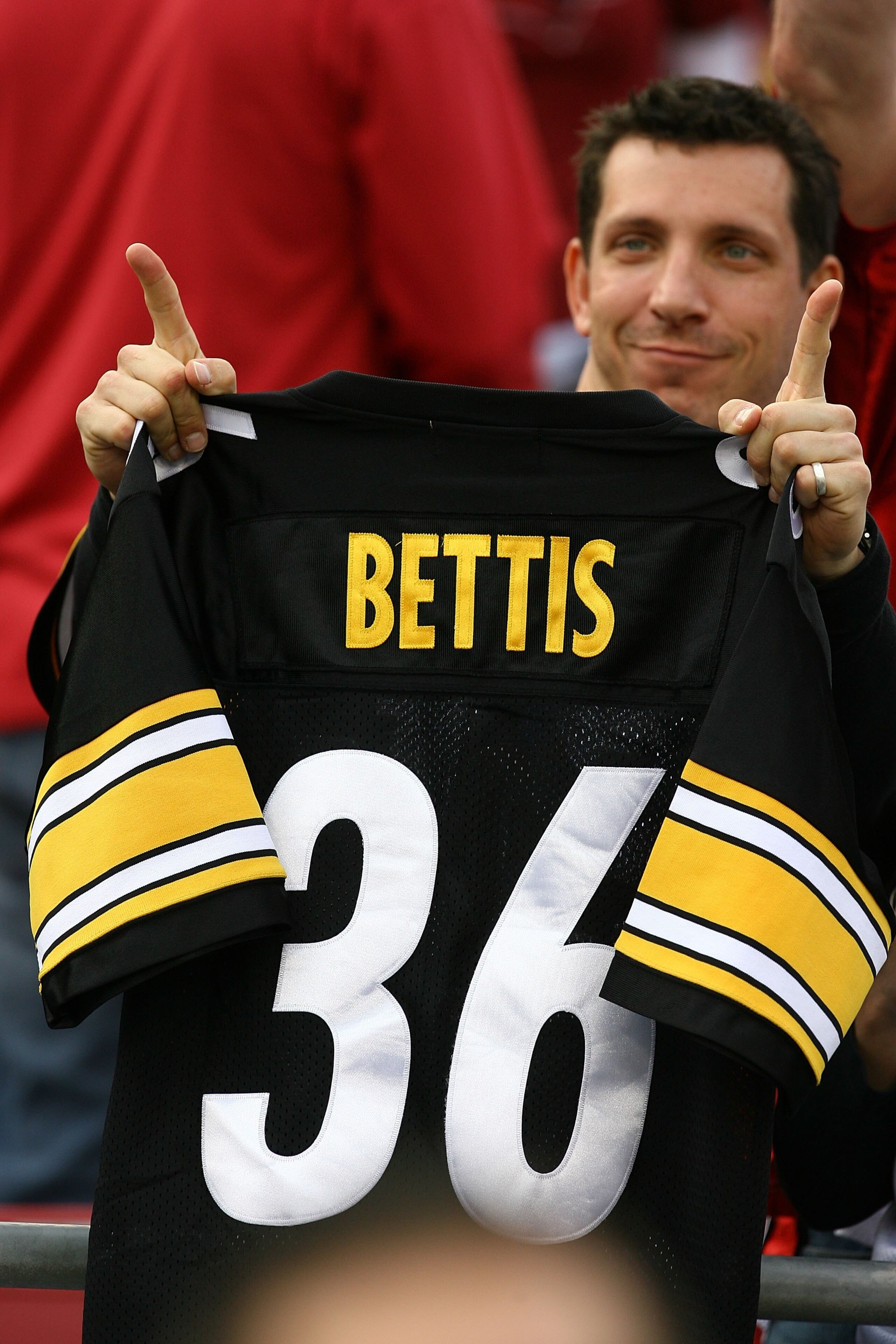 TAMPA, FL - FEBRUARY 01:  A fan of the Pittsburgh Steelers holds up a Jerome Bettis jersey from the stands against the Arizona Cardinals during Super Bowl XLIII on February 1, 2009 at Raymond James Stadium in Tampa, Florida.  (Photo by Jamie Squire/Getty