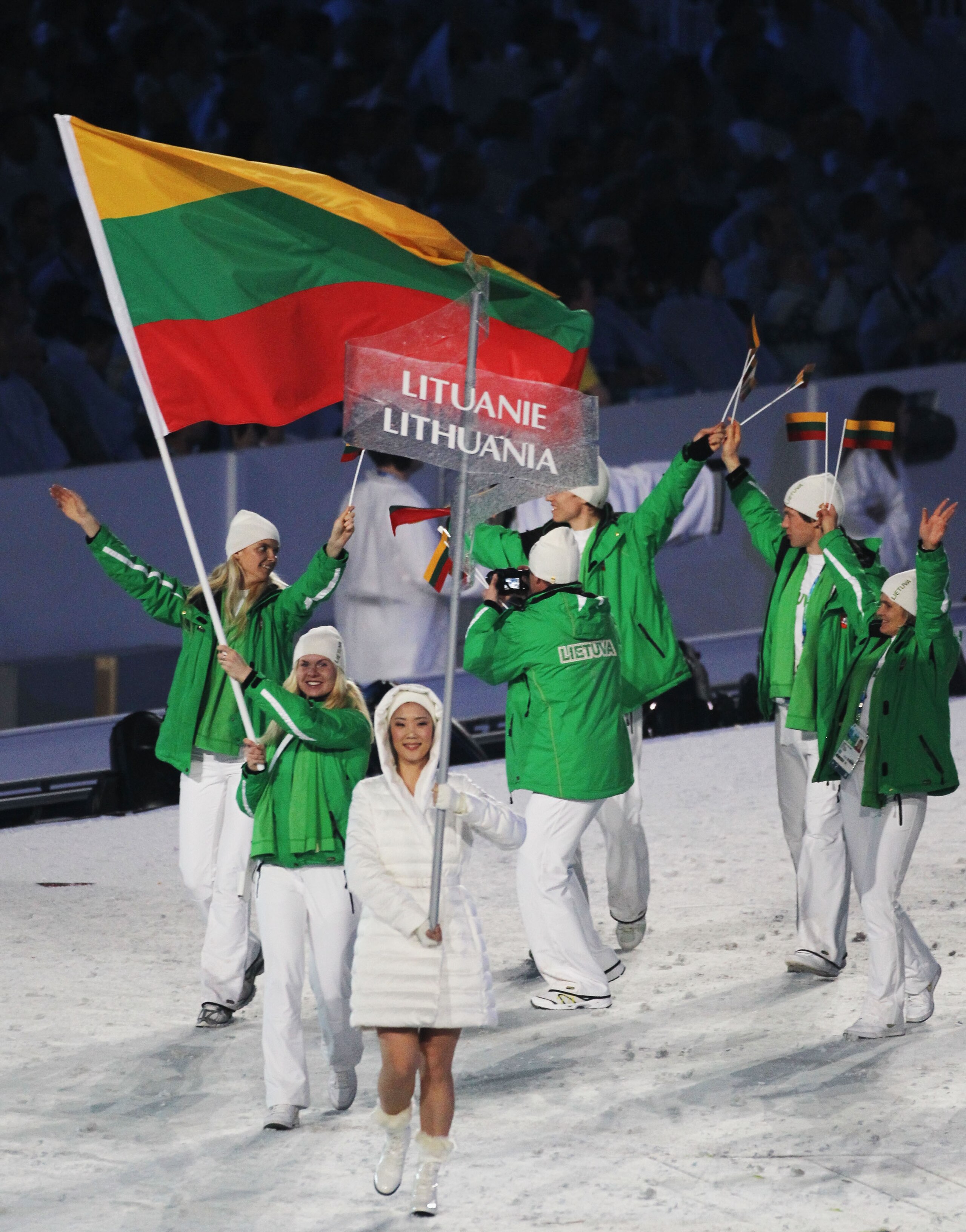 VANCOUVER, BC - FEBRUARY 12: Irina Terentjeva of Lithuania carries the flag during the Opening Ceremony of the 2010 Vancouver Winter Olympics at BC Place on February 12, 2010 in Vancouver, Canada.  (Photo by Matthew Stockman/Getty Images)