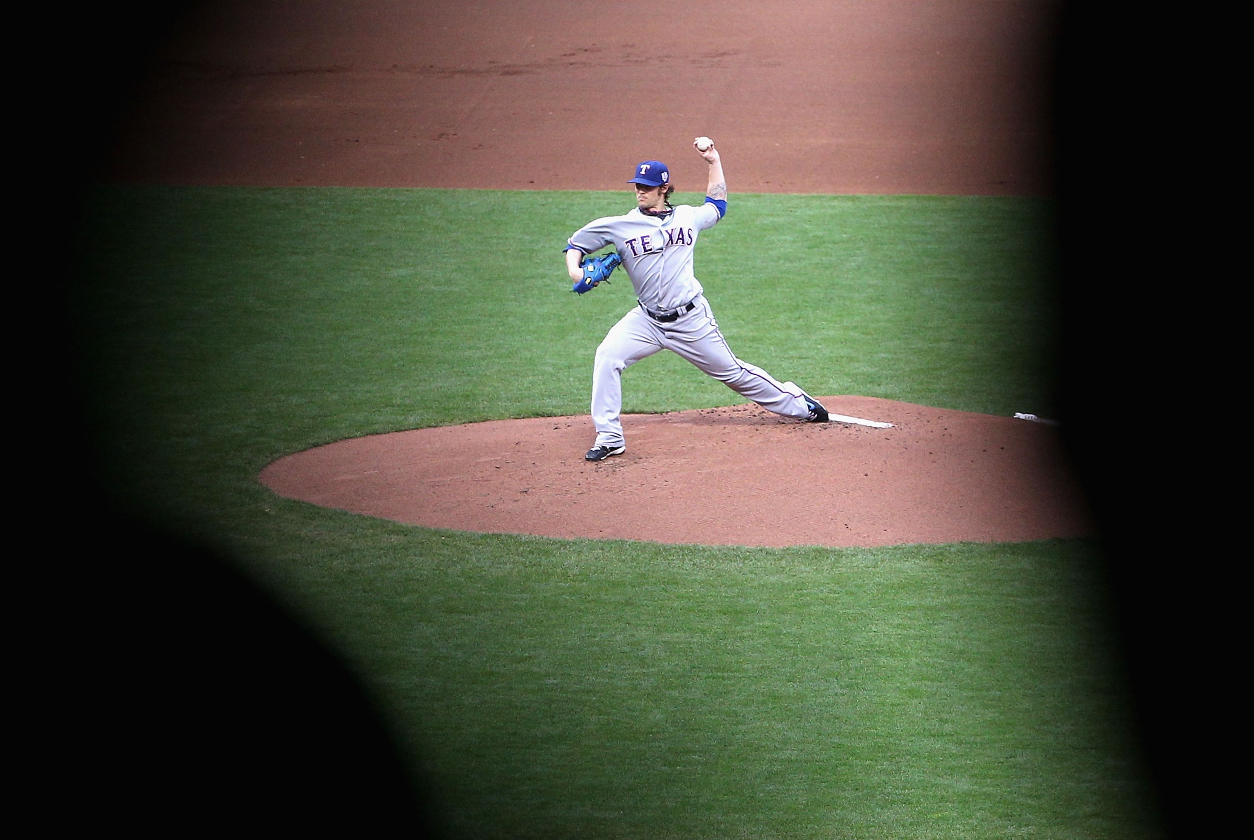 SAN FRANCISCO - OCTOBER 28:  Starting pitcher C.J. Wilson #36 of the Texas Rangers pitches while taking on the San Francisco Giants in Game Two of the 2010 MLB World Series at AT&T Park on October 28, 2010 in San Francisco, California. (Photo by Christian