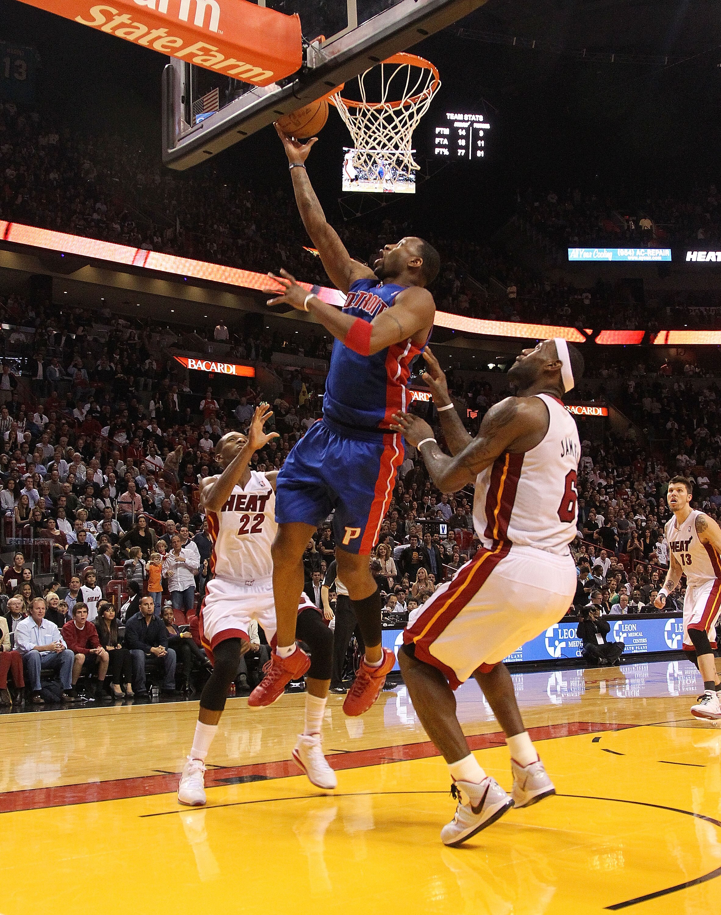 MIAMI, FL - JANUARY 28:  Tracy McGrady #1 of of the Detroit Pistons drives against LeBron James #6 of the Miami Heat during a game at American Airlines Arena on January 28, 2011 in Miami, Florida. NOTE TO USER: User expressly acknowledges and agrees that,