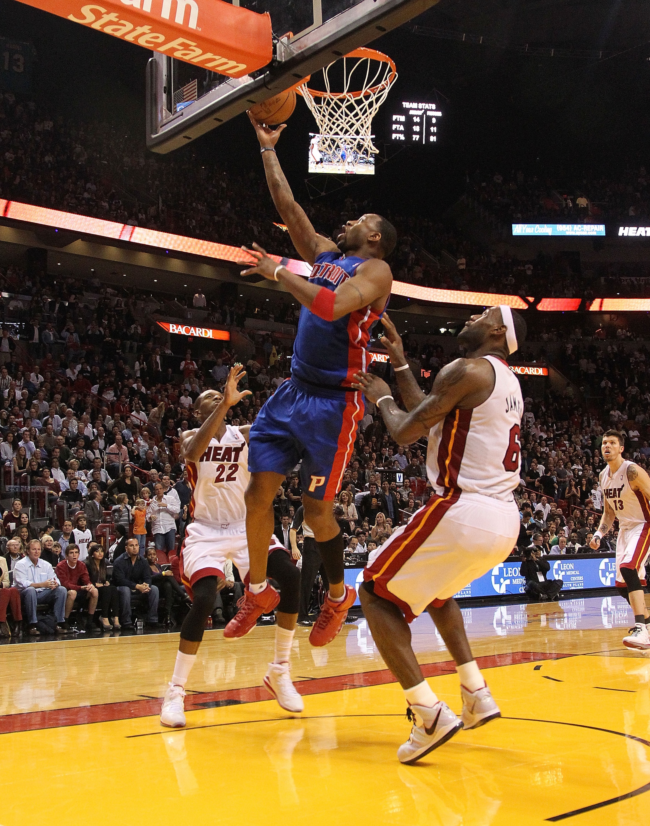 MIAMI, FL - JANUARY 28:  Tracy McGrady #1 of of the Detroit Pistons drives against LeBron James #6 of the Miami Heat during a game at American Airlines Arena on January 28, 2011 in Miami, Florida. NOTE TO USER: User expressly acknowledges and agrees that,