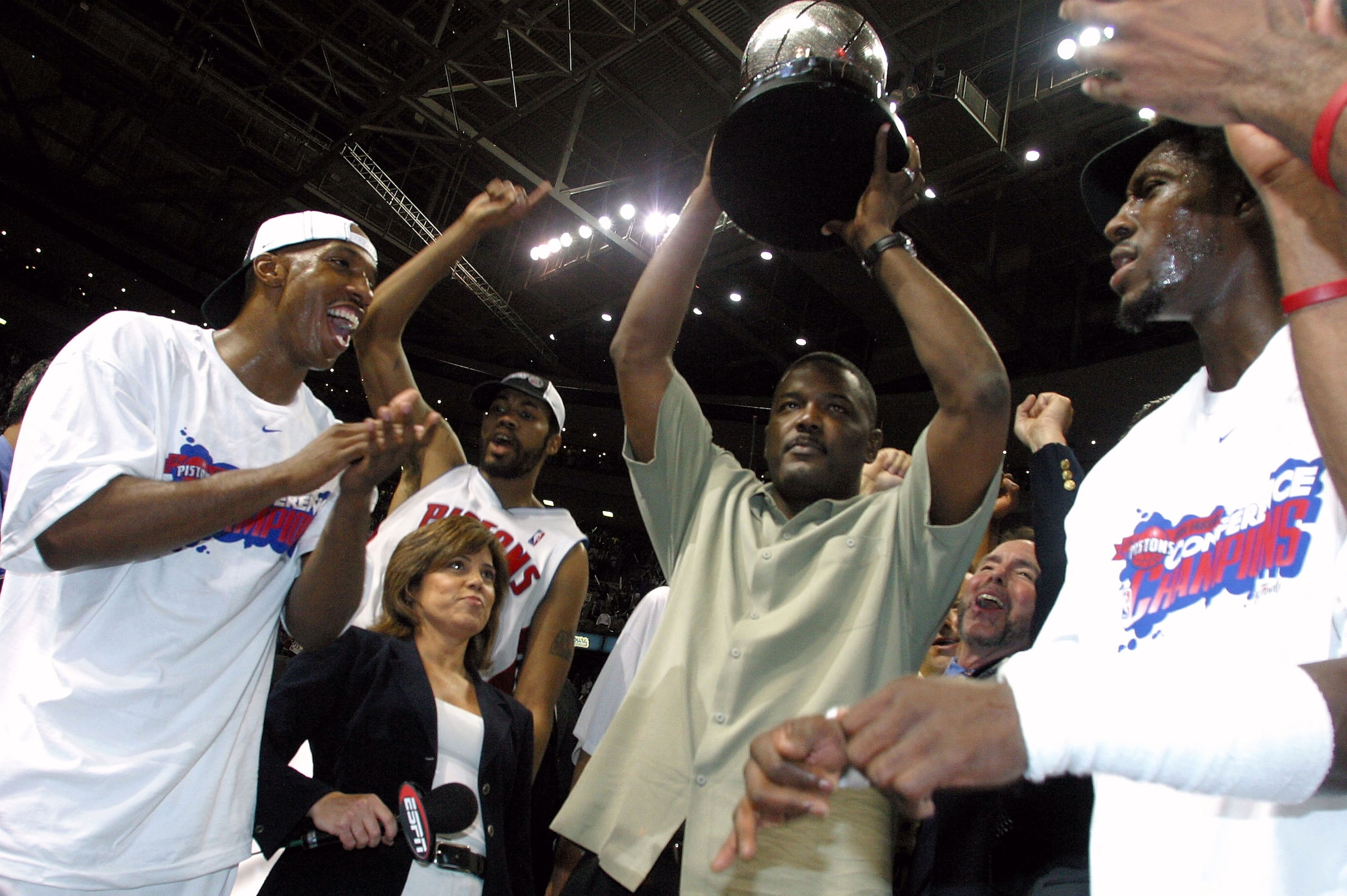 AUBURN HILLS, MI - JUNE 1:  (L-R) Chauncey Billups #1, Rasheed Wallace #30, President of Basketball Operations Joe Dumars (holding trophy) and Ben Wallace #3 of the Detroit Pistons celebrate their win over the Indiana Pacers in Game six of the Eastern Con