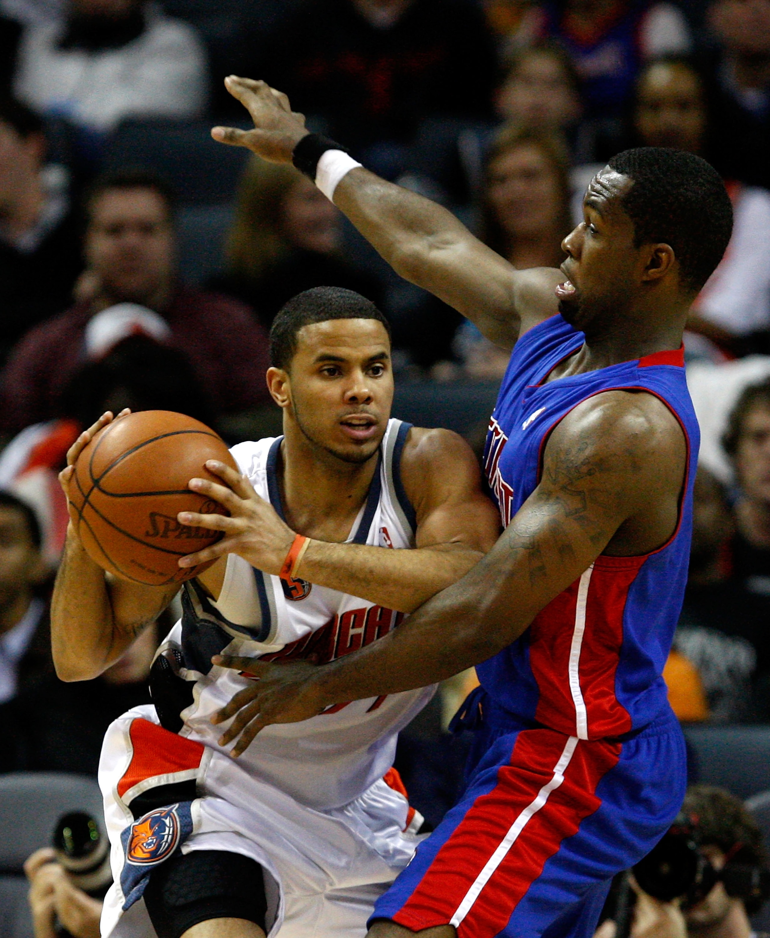 CHARLOTTE, NC - DECEMBER 13:  D.J. Augustin #14 of the Charlotte Bobcats tries to keep the ball away from Rodney Stuckey #3 of the Detroit Pistons during their game at Time Warner Cable Arena on December 13, 2008 in Charlotte, North Carolina.  NOTE TO USE