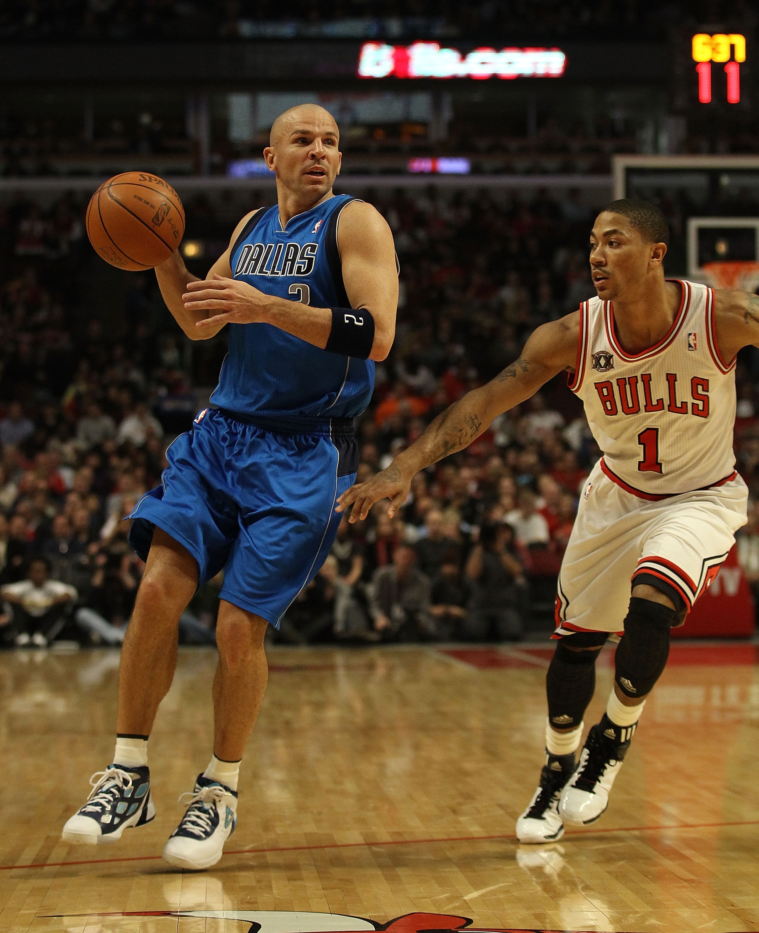 CHICAGO, IL - JANUARY 20: Jason Kidd #2 of the Dallas Mavericks looks to pass under pressure from Derrick Rose #1 of the Chicago Bulls at the United Center on January 20, 2011 in Chicago, Illinois. The Bulls defeated the Mavericks 82-77. NOTE TO USER: Use