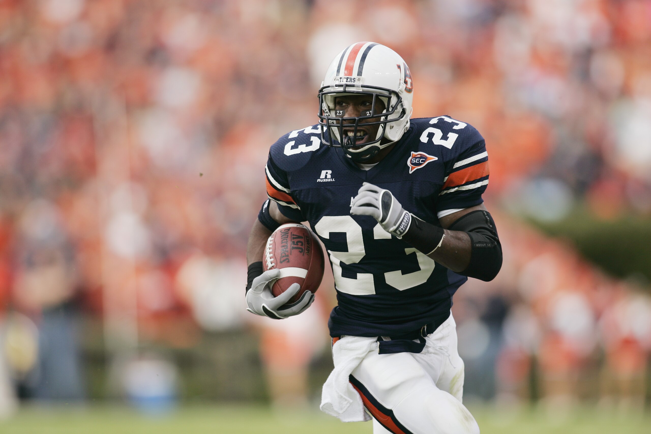 AUBURN, AL - NOVEMBER 19: Tailback Kenny Irons #23 of the Auburn Tigers carries the ball against the Alabama Crimson Tide at Jordan-Hare Stadium on November 19, 2005 in Auburn, Alabama. Auburn defeated Alabama 28-18. (Photo by Chris Graythen/Getty Imag AUBURN, AL - NOVEMBER 19: Tailback Kenny Irons #23 of the Auburn Tigers carries the ball against the Alabama Crimson Tide at Jordan-Hare Stadium on November 19, 2005 in Auburn, Alabama. Auburn defeated Alabama 28-18. (Photo by Chris Graythen/Getty Imag