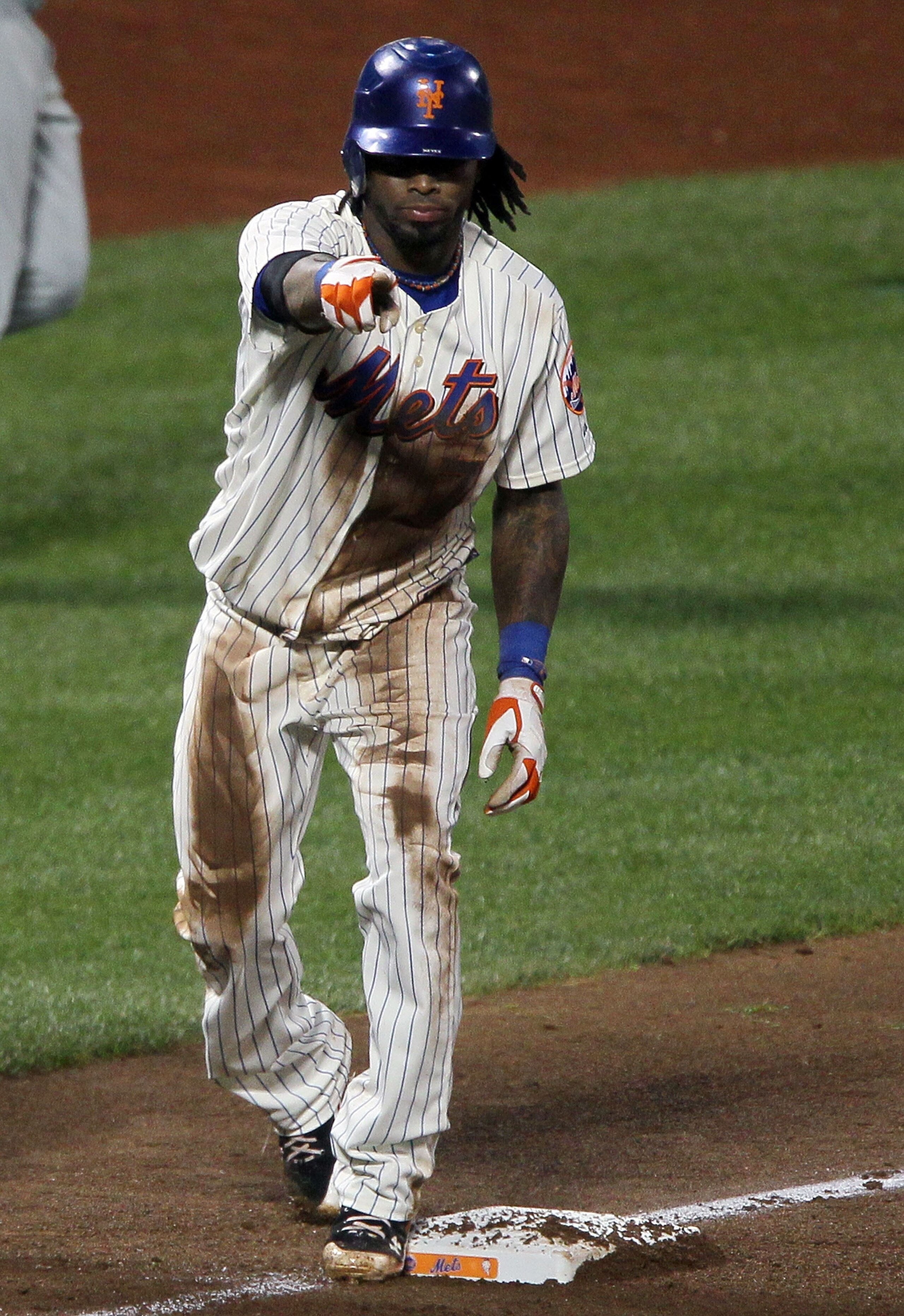 NEW YORK - AUGUST 14:  Jose Reyes #7 of the New York Mets celebrates his triple against the Philadelphia Phillies on August 14, 2010 at Citi Field in the Flushing neighborhood of the Queens borough of New York City.  (Photo by Jim McIsaac/Getty Images)