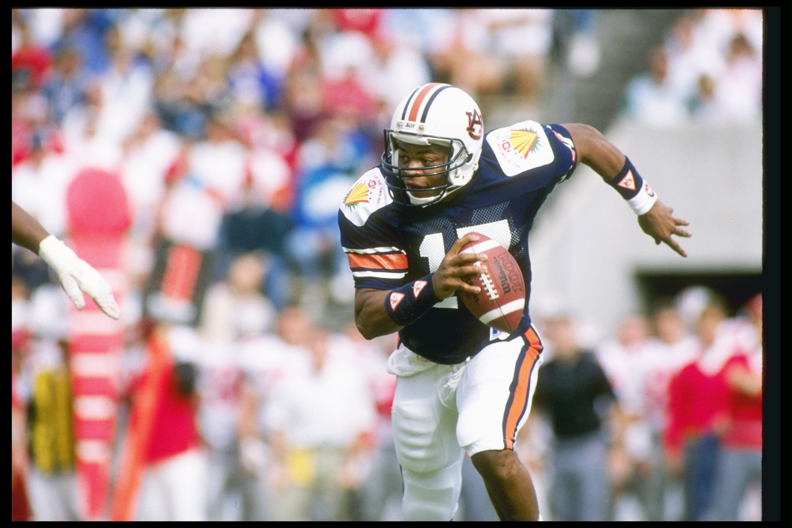 1990: Quarterback Reggie Slack of the Auburn Tigers runs down the field during a game against the Ohio State Buckeyes at the Hall of Fame Bowl in Florida. Auburn won the game 31-14. Mandatory Credit: Scott Halleran /Allsport 1990: Quarterback Reggie Slack of the Auburn Tigers runs down the field during a game against the Ohio State Buckeyes at the Hall of Fame Bowl in Florida. Auburn won the game 31-14. Mandatory Credit: Scott Halleran /Allsport