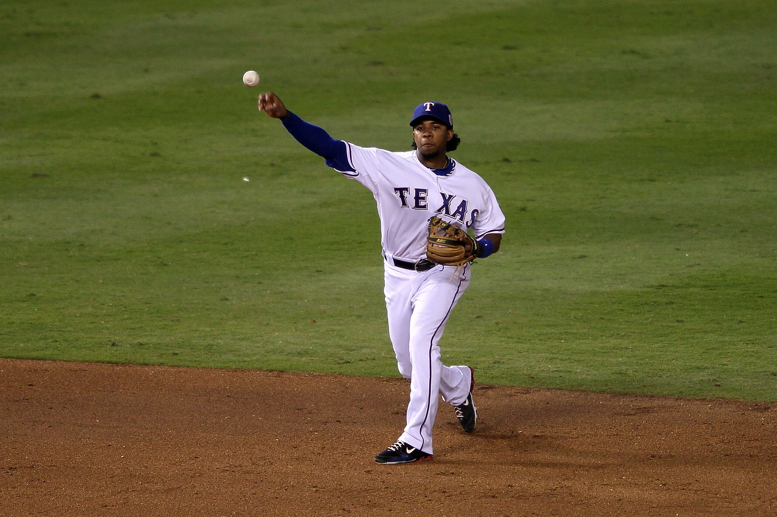 ARLINGTON, TX - NOVEMBER 01:  Elvis Andrus #1 of the Texas Rangers throws the ball to first base against the San Francisco Giants in Game Five of the 2010 MLB World Series at Rangers Ballpark in Arlington on November 1, 2010 in Arlington, Texas.  (Photo b