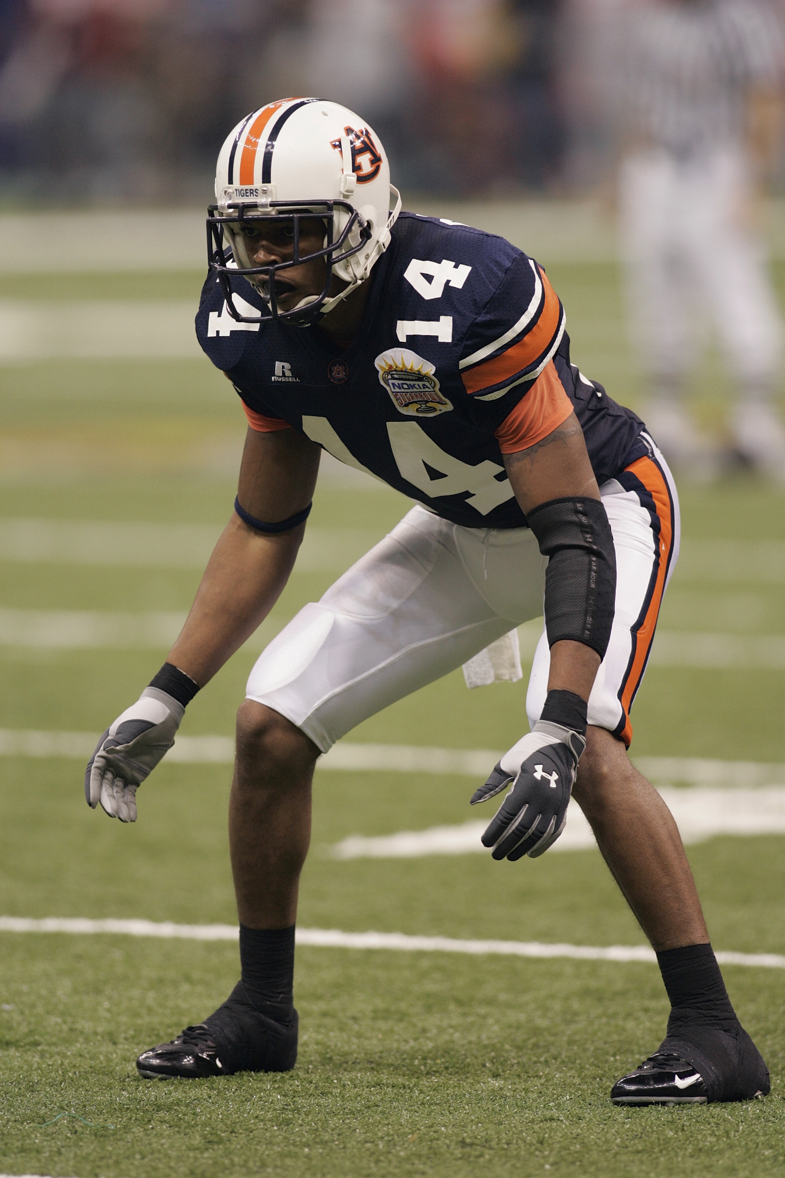 NEW ORLEANS - JANUARY 3: Defensive back Carlos Rogers #14 of the Auburn Tigers looks on while facing the Virginia Tech Hokies during the Nokia Sugar Bowl on January 3, 2005 at the Superdome in New Orleans, Louisiana. Auburn defeated Virginia Tech 16-13. NEW ORLEANS - JANUARY 3: Defensive back Carlos Rogers #14 of the Auburn Tigers looks on while facing the Virginia Tech Hokies during the Nokia Sugar Bowl on January 3, 2005 at the Superdome in New Orleans, Louisiana. Auburn defeated Virginia Tech 16-13.