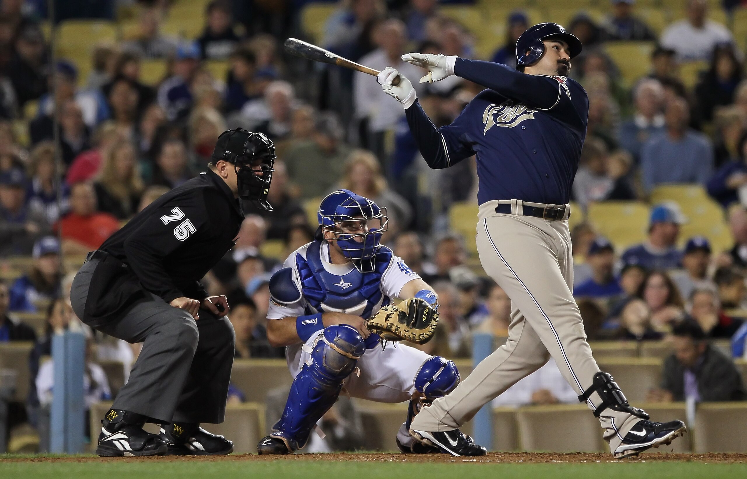 LOS ANGELES, CA - SEPTEMBER 22:  Adrian Gonzalez  #23 of the San Diego Padres hits a single in the fifth inning against the Los Angeles Dodgers at Dodger Stadium on September 22, 2010 in Los Angeles, California.  (Photo by Jeff Gross/Getty Images)