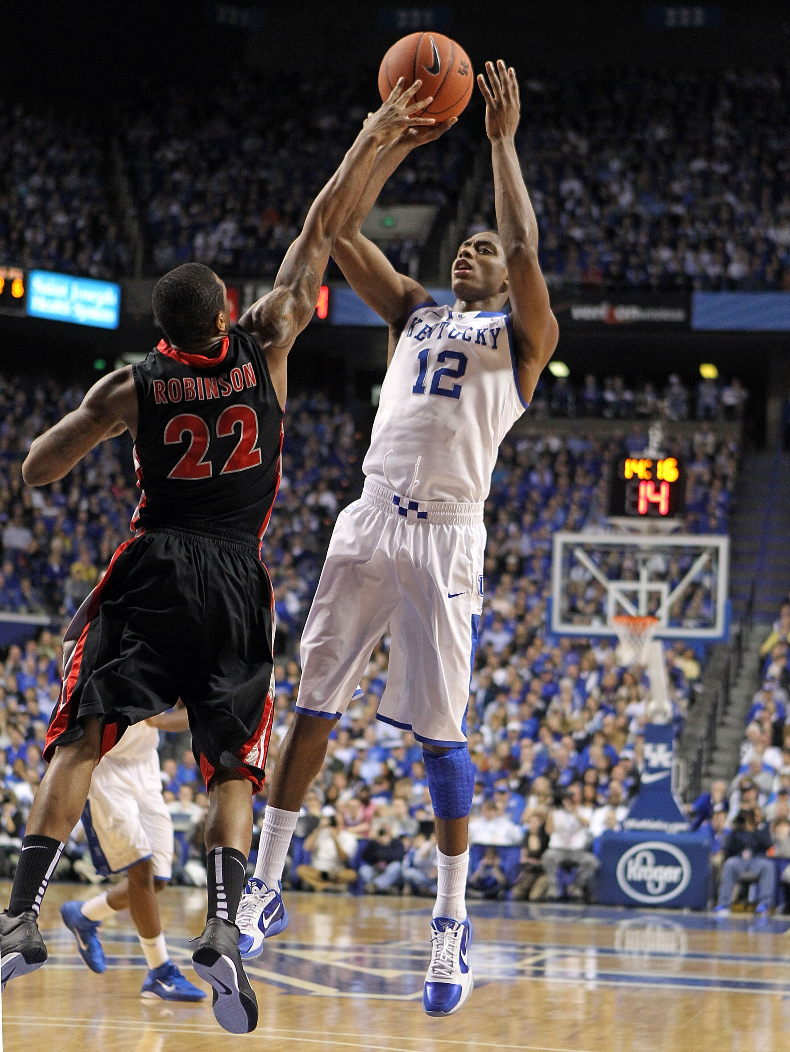 LEXINGTON, KY - JANUARY 29: Brandon Knight #12 of the Kentucky Wildcats shoots the ball while defended by Gerald Robinson #22 of the Georgia Bulldogs during the SEC game at Rupp Arena on January 29, 2011 in Lexington, Kentucky. Kentucky won 66-60. (Pho LEXINGTON, KY - JANUARY 29: Brandon Knight #12 of the Kentucky Wildcats shoots the ball while defended by Gerald Robinson #22 of the Georgia Bulldogs during the SEC game at Rupp Arena on January 29, 2011 in Lexington, Kentucky. Kentucky won 66-60. (Pho