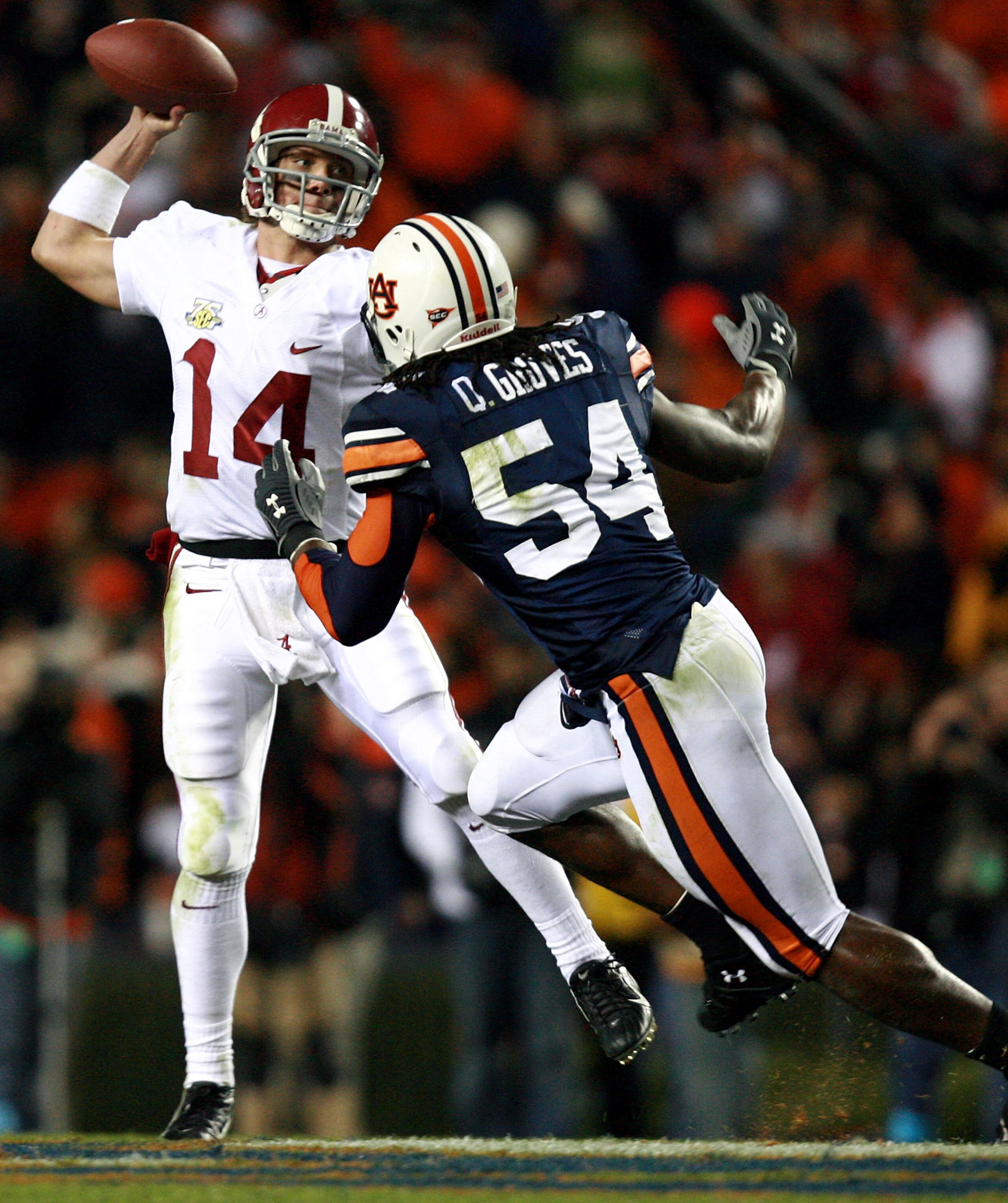 AUBURN, AL - NOVEMBER 24: Quarterback John Parker Wilson #14 of the Alabama Crimson Tide is forced to get rid of the ball early by linebacker Quentin Groves #54 of the Auburn Tigers at Jordan-Hare Stadium on November 24, 2007 in Auburn, Alabama. Auburn AUBURN, AL - NOVEMBER 24: Quarterback John Parker Wilson #14 of the Alabama Crimson Tide is forced to get rid of the ball early by linebacker Quentin Groves #54 of the Auburn Tigers at Jordan-Hare Stadium on November 24, 2007 in Auburn, Alabama. Auburn