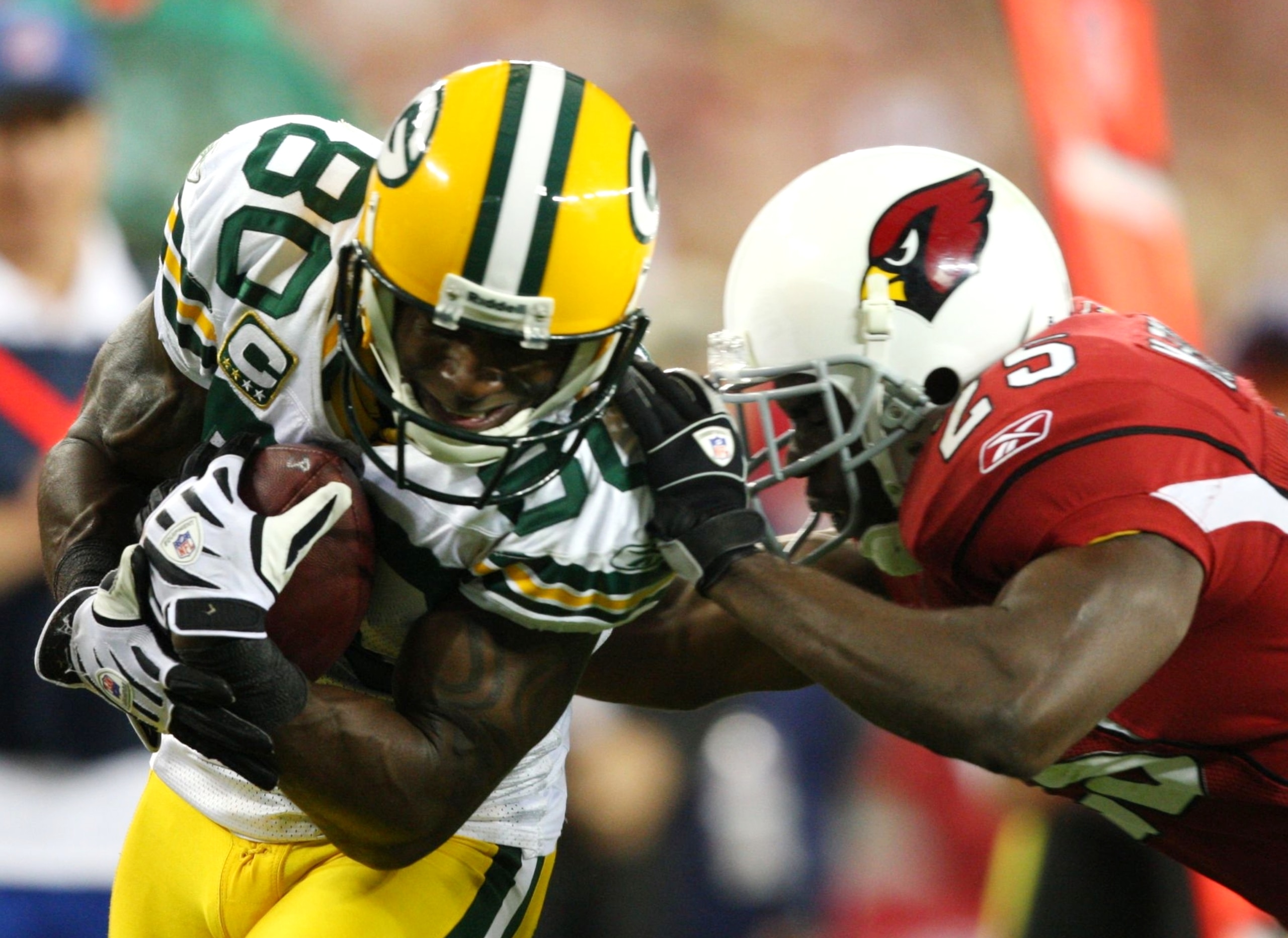 GLENDALE, AZ - JANUARY 10: Donald Driver #80 of the Green Bay Packers is tackled by Bryant McFadden #25 of the Arizona Cardinals during the fourth quarter of the 2010 NFC wild-card playoff game at University of Phoenix Stadium on January 10, 2010 in Glen GLENDALE, AZ - JANUARY 10: Donald Driver #80 of the Green Bay Packers is tackled by Bryant McFadden #25 of the Arizona Cardinals during the fourth quarter of the 2010 NFC wild-card playoff game at University of Phoenix Stadium on January 10, 2010 in Glen