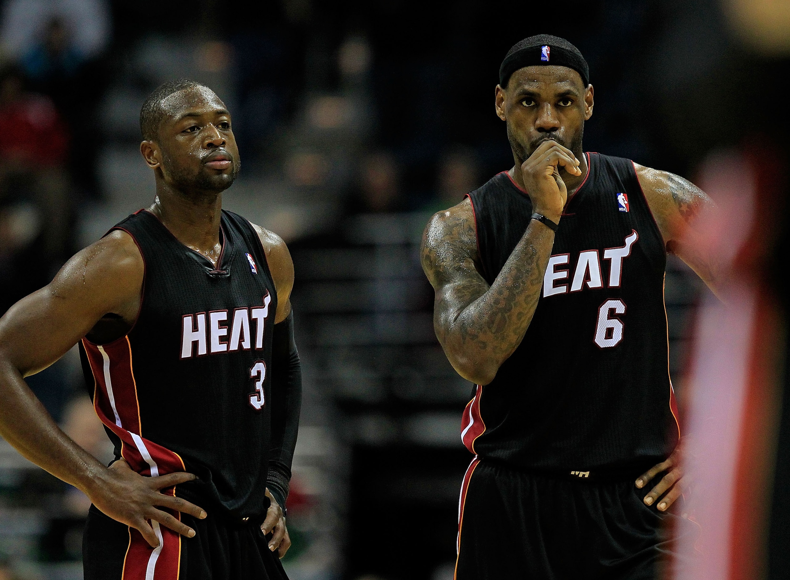 MILWAUKEE, WI - DECEMBER 06: (L-R) Dwyane Wade #3 and LeBron James #6 of the Miami Heat watch as a teammate readies to shoot a free-throw against the Milwaukee Bucks at the Bradley Center on December 6, 2010 in Milwaukee, Wisconsin. The Heat defeated the